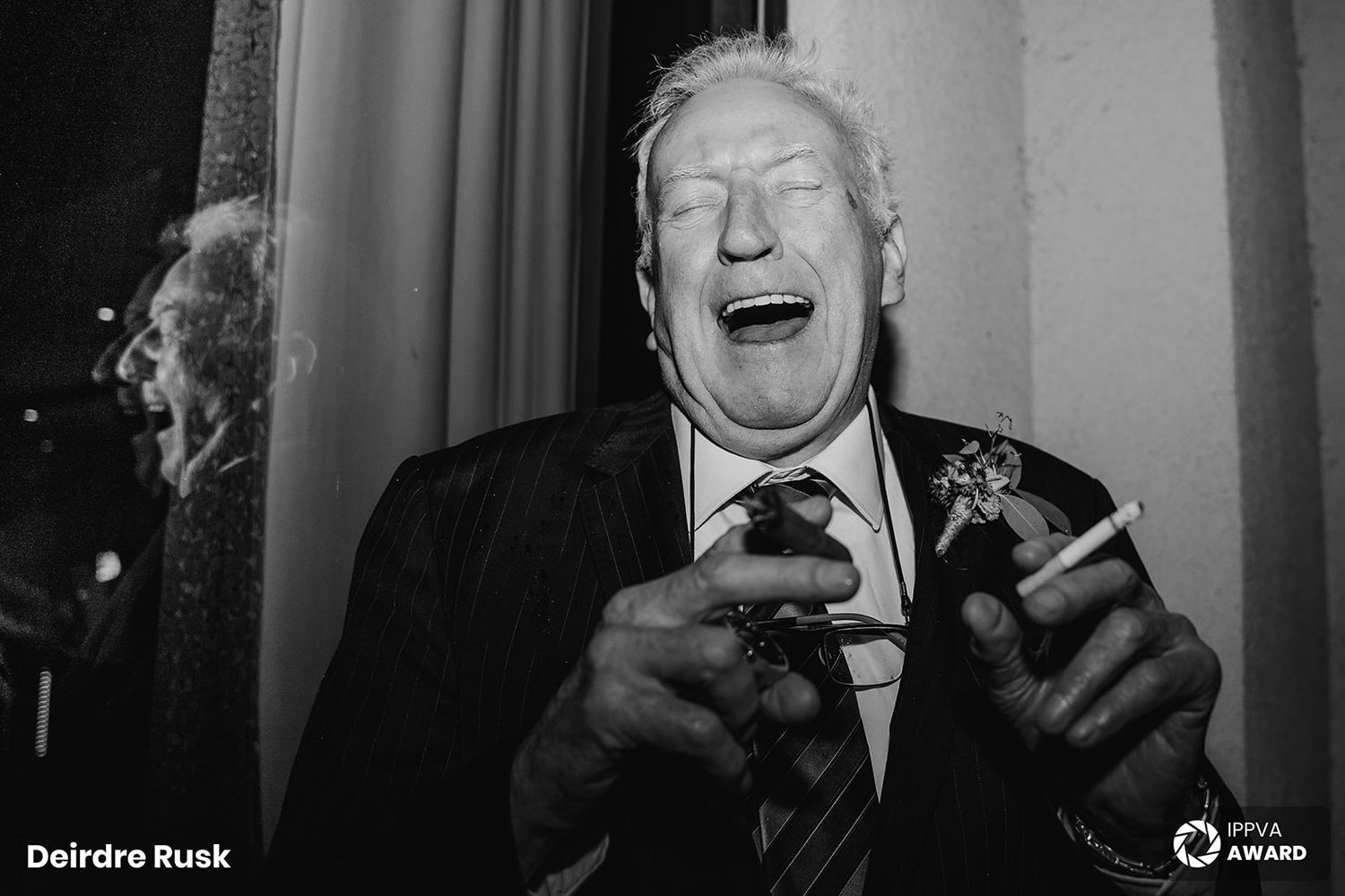 Black and white candid portraits of laughing expressions captured in dramatic monochromatic lighting.