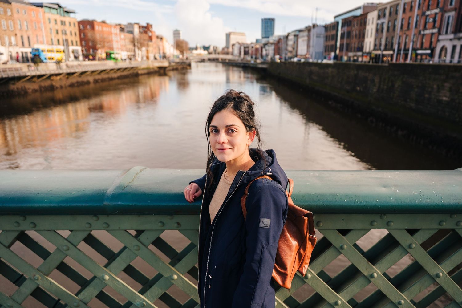 A scenic view of Venice's iconic canals with historic buildings and bridges reflecting in the tranquil water. professional headshots dublin
