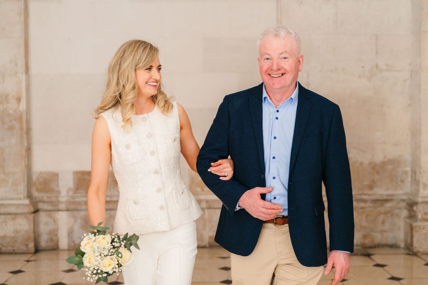 Light and airy wedding portraits captured against rustic stone wall backdrop. City Hall Dublin wedding photogrAPher