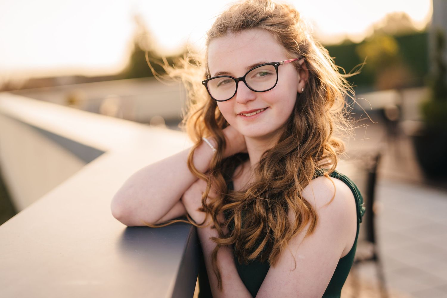 Artistic outdoor portrait series at golden hour featuring glasses and natural expressions.  Wedding PHOTOGRAPHER Trim Castle