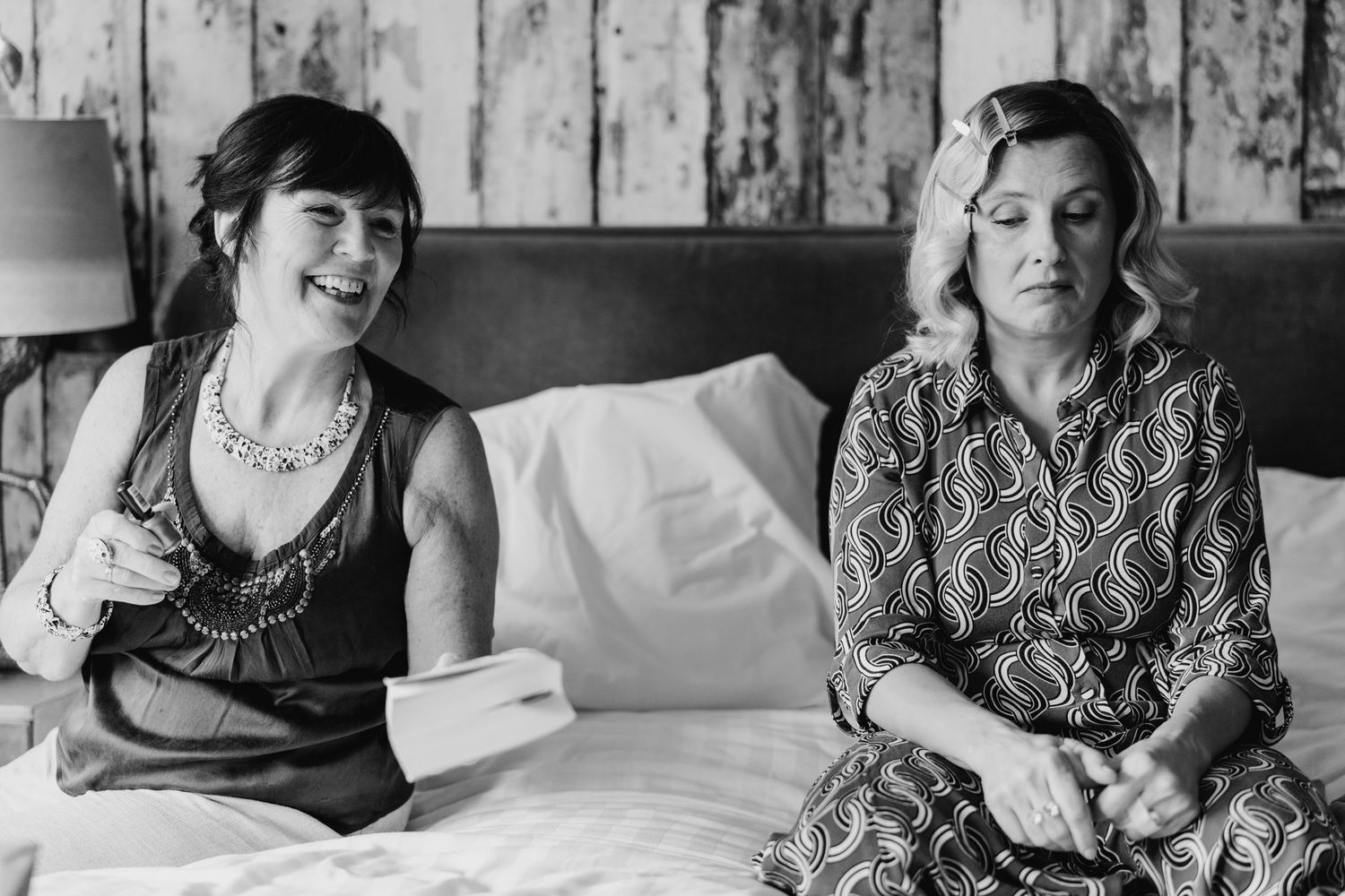 Monochromatic series showing laughter and joy during candid moments between two people in bed. House Dublin Wedding Photographer