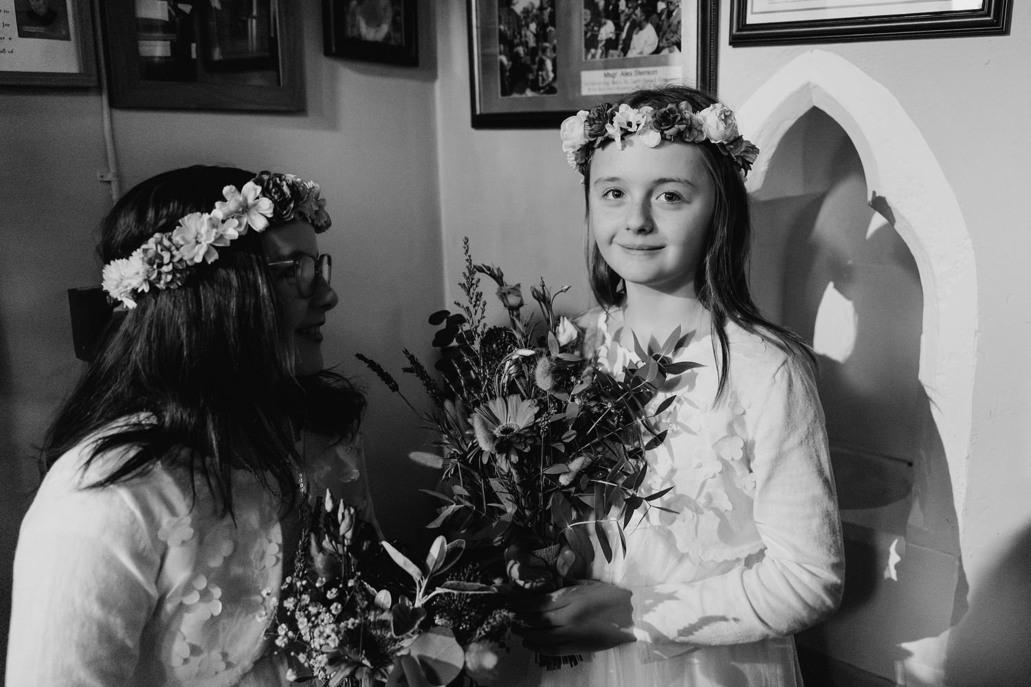 Black and white photos showing wedding preparation moments in an intimate setting.