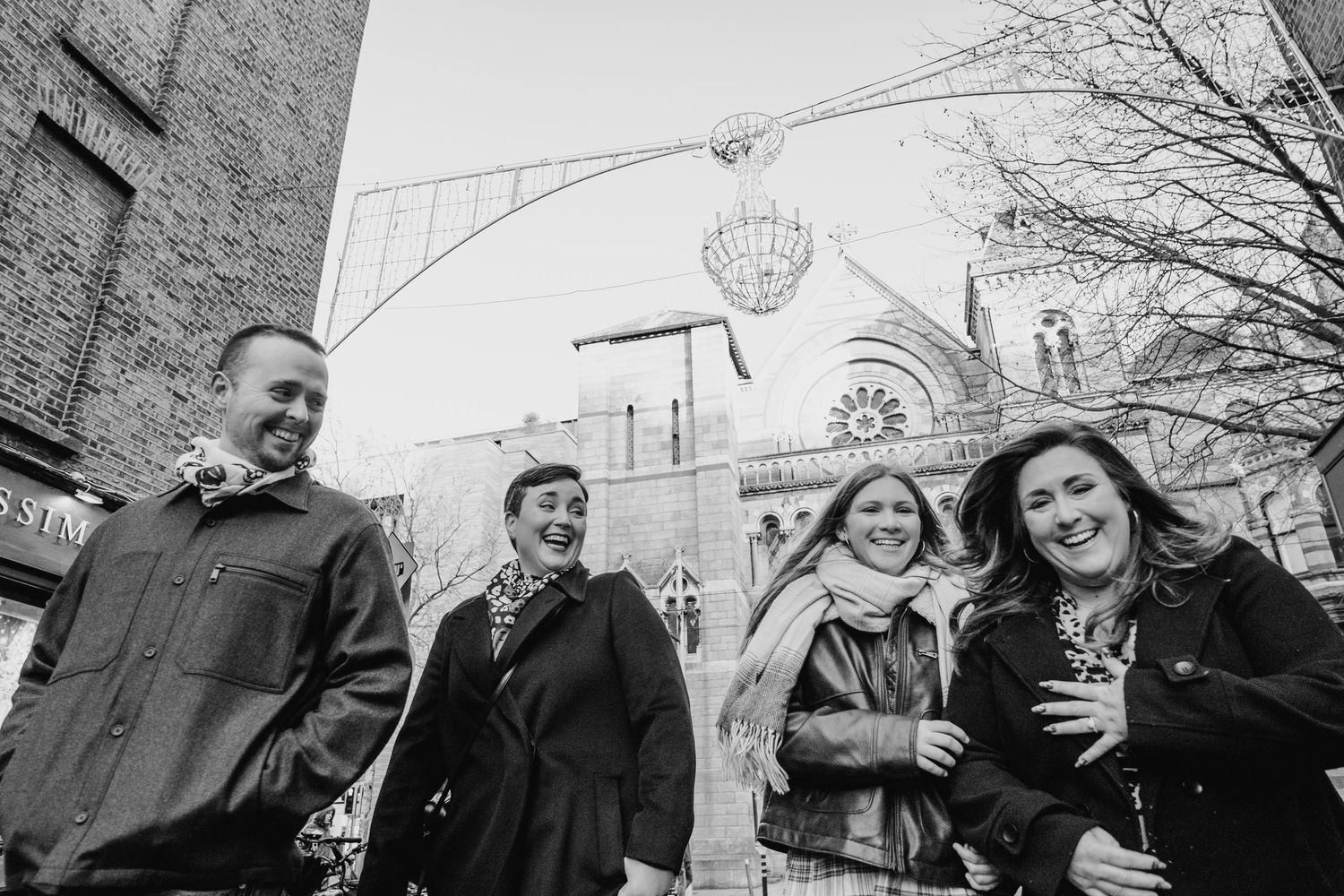 Winter engagement photoshoot with couple sharing candid moments outdoors. family PHOTOGRAPHER Dublin