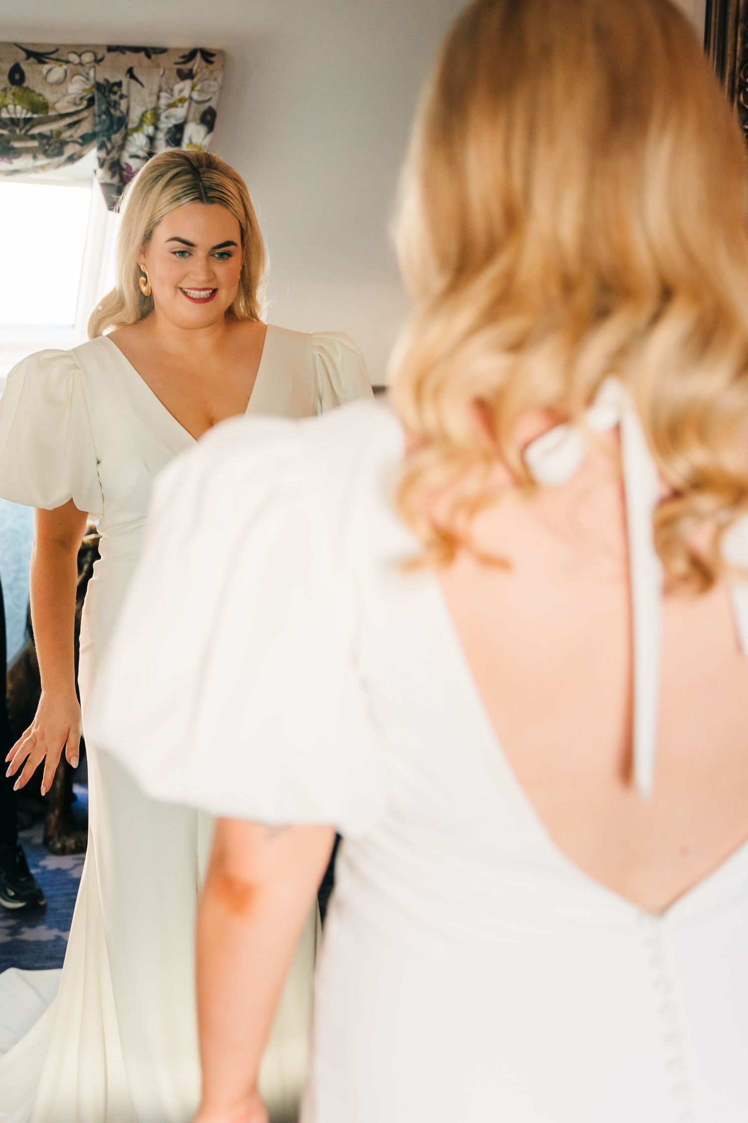 A series of getting ready shots showing a bride in a white dress preparing for her wedding day. Wedding photographer dublin