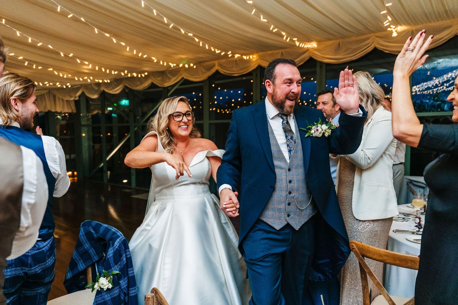 Wedding reception under twinkling lights with dancing and celebration.  Virginia Park Lodge Wedding Photographer Cavan Dublin Ireland
