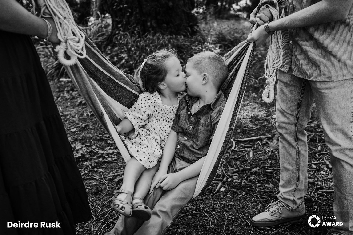 Black and white photo of a relaxed moment in a backyard hammock. Family PHOTOGRAPHER Dublin