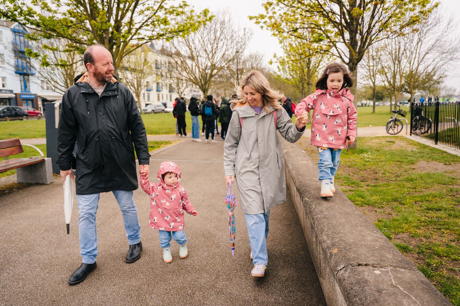 People enjoying a walk together on a tree-lined path in an urban park on a pleasant autumn day. PHOTOGRAPHER Dublin