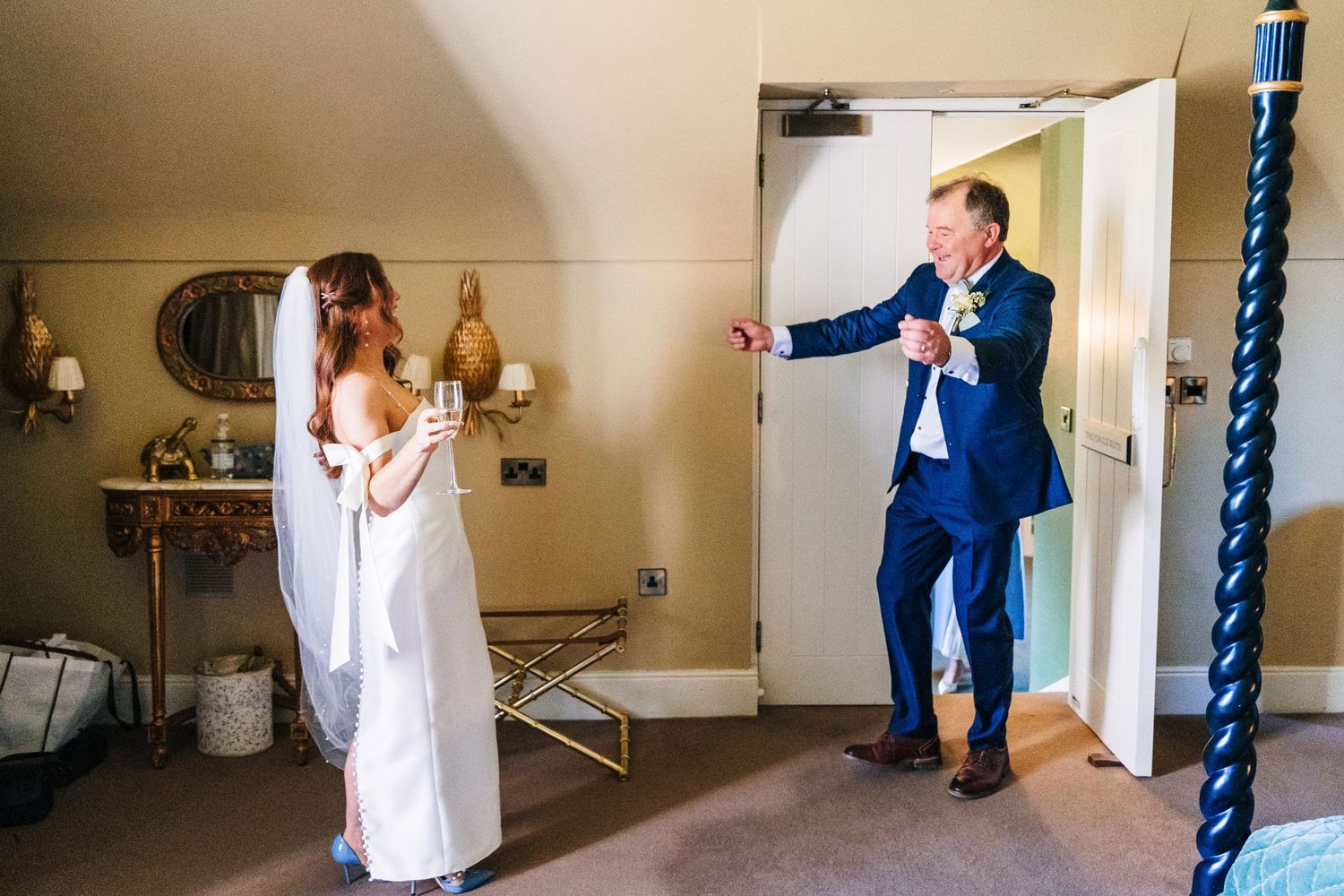 Castle Leslie Wedding Photographer Dublin A wedding moment captured as someone in white reacts to another person entering the room.