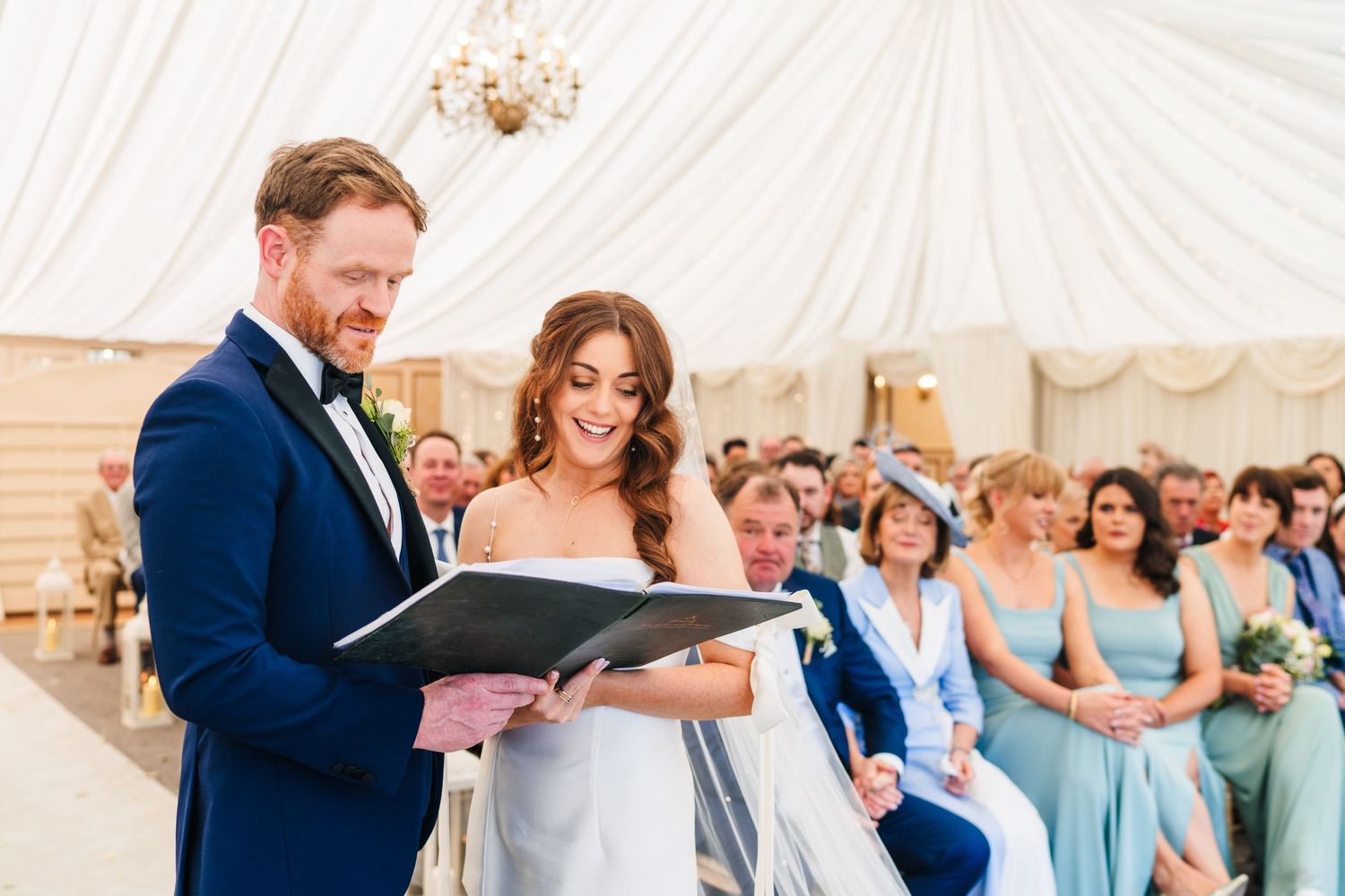Castle Leslie Wedding Photographer Dublin Wedding celebration inside elegant white tent with light blue bridesmaids dresses.