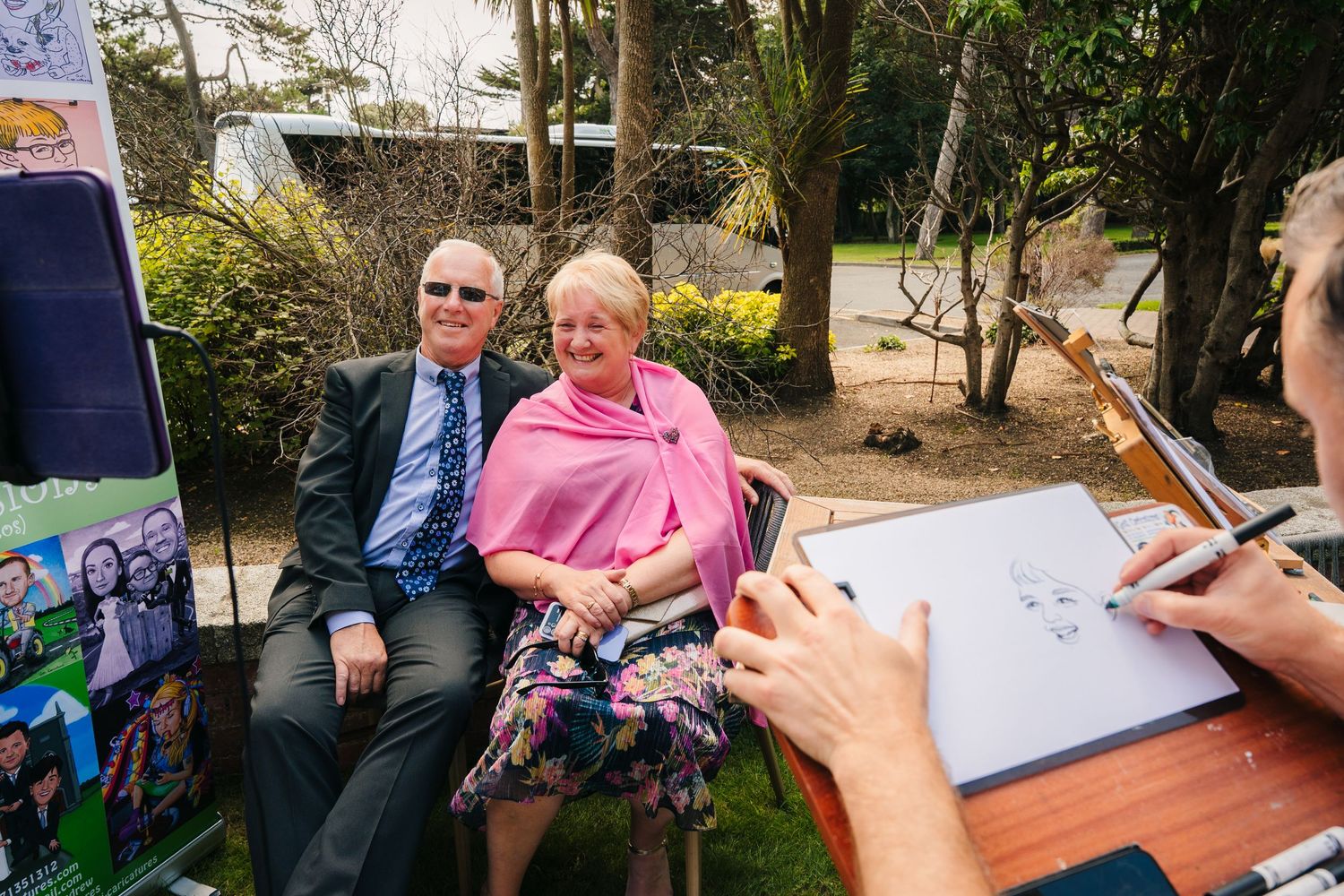 Wedding guests signing guest book and sharing memories at reception. Portmarnock Hotel Wedding PHOTOGRAPHER Dublin