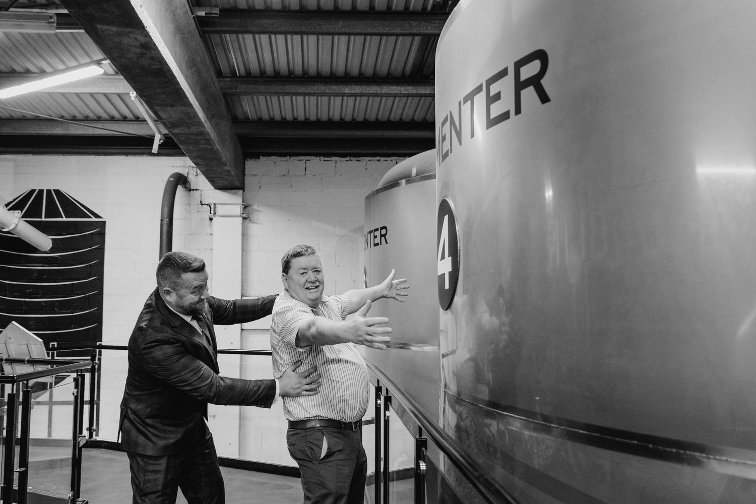 Industrial workspace with large metallic equipment and machinery in black and white. Dublin wedding photogrAPher