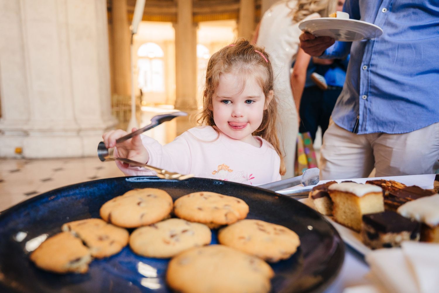 A plate of freshly baked cookies on a dark tray during what appears to be a celebration. City Hall Dublin wedding photogrAPher