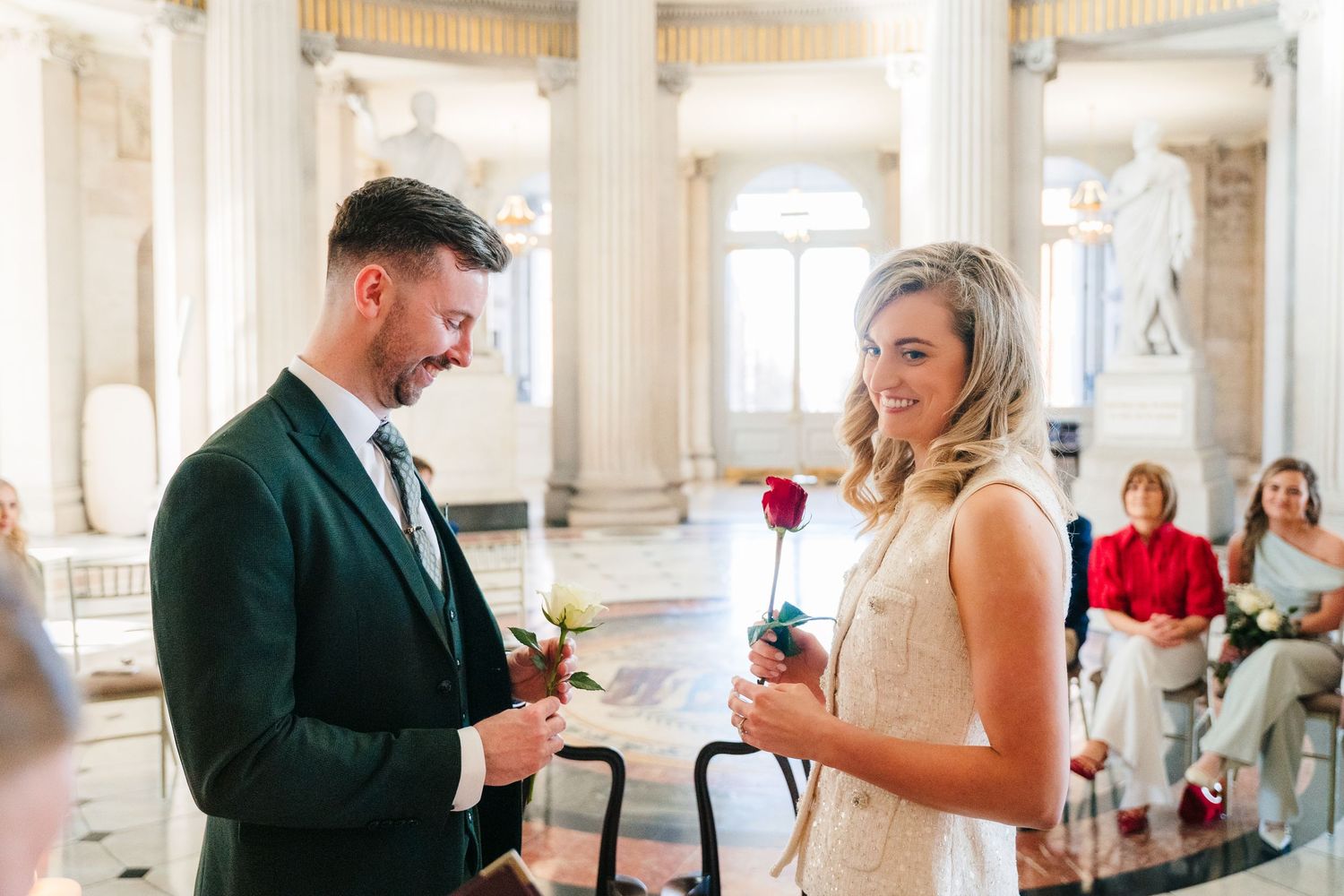 Elegant wedding reception in a columned hall with classic architectural details. City Hall Dublin wedding photogrAPher