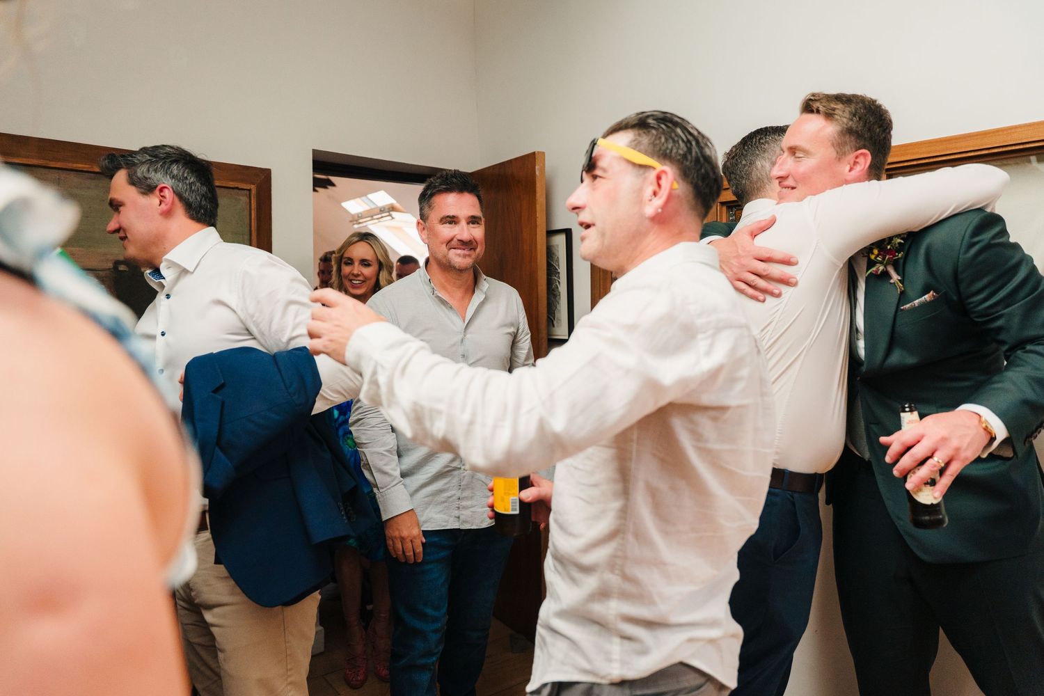 People dancing and celebrating at an indoor party venue. Same sex wedding PHOTOGRAPHER Dublin