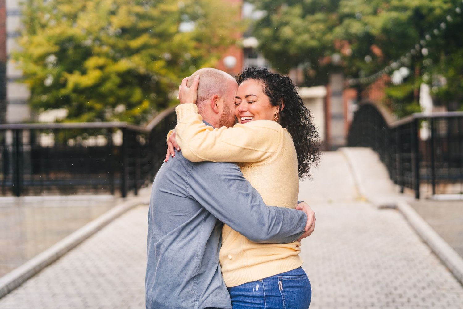 Couple sharing romantic embraces in an autumn park setting with golden foliage. Proposal Dublin Photographer