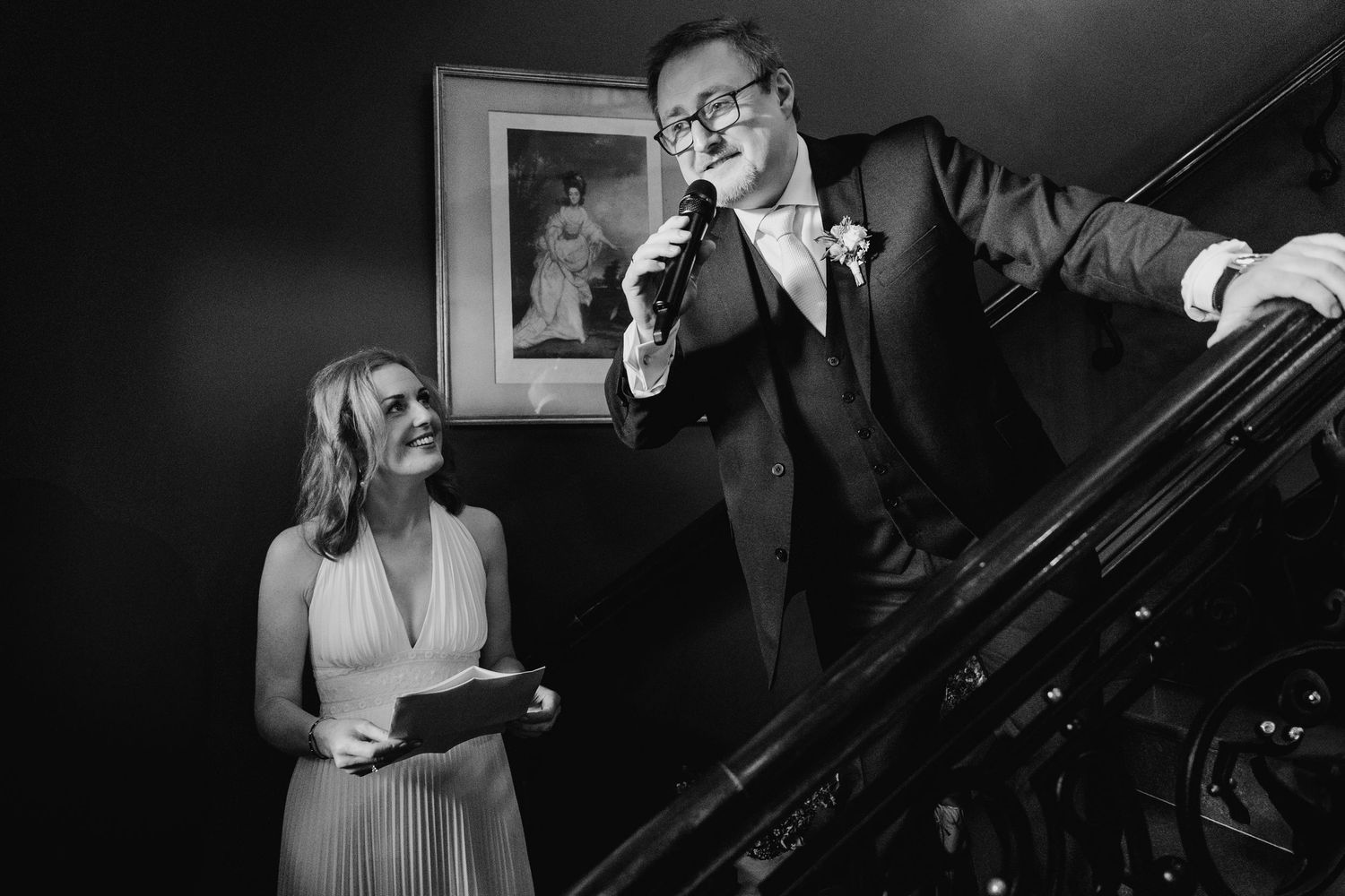 Musicians perform together on stage in a moody black and white concert setting. Wedding PHOTOGRAPHER Dublin