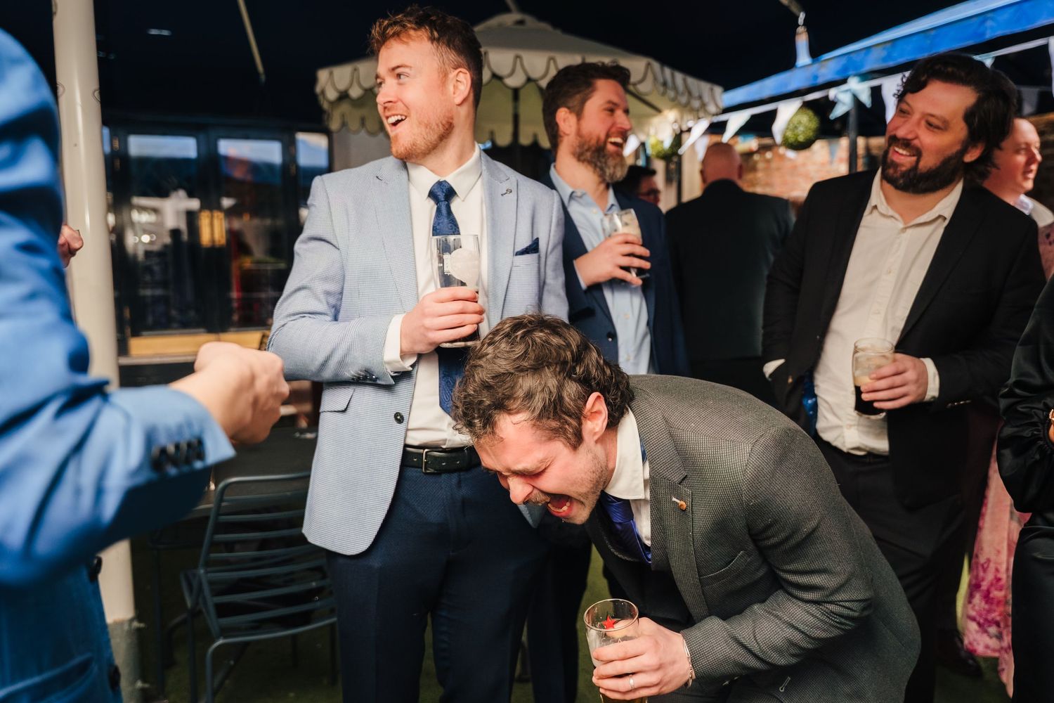 Wedding guests in the private courtyard at the Set Theatre Kilkenny Wedding photographer Dublin