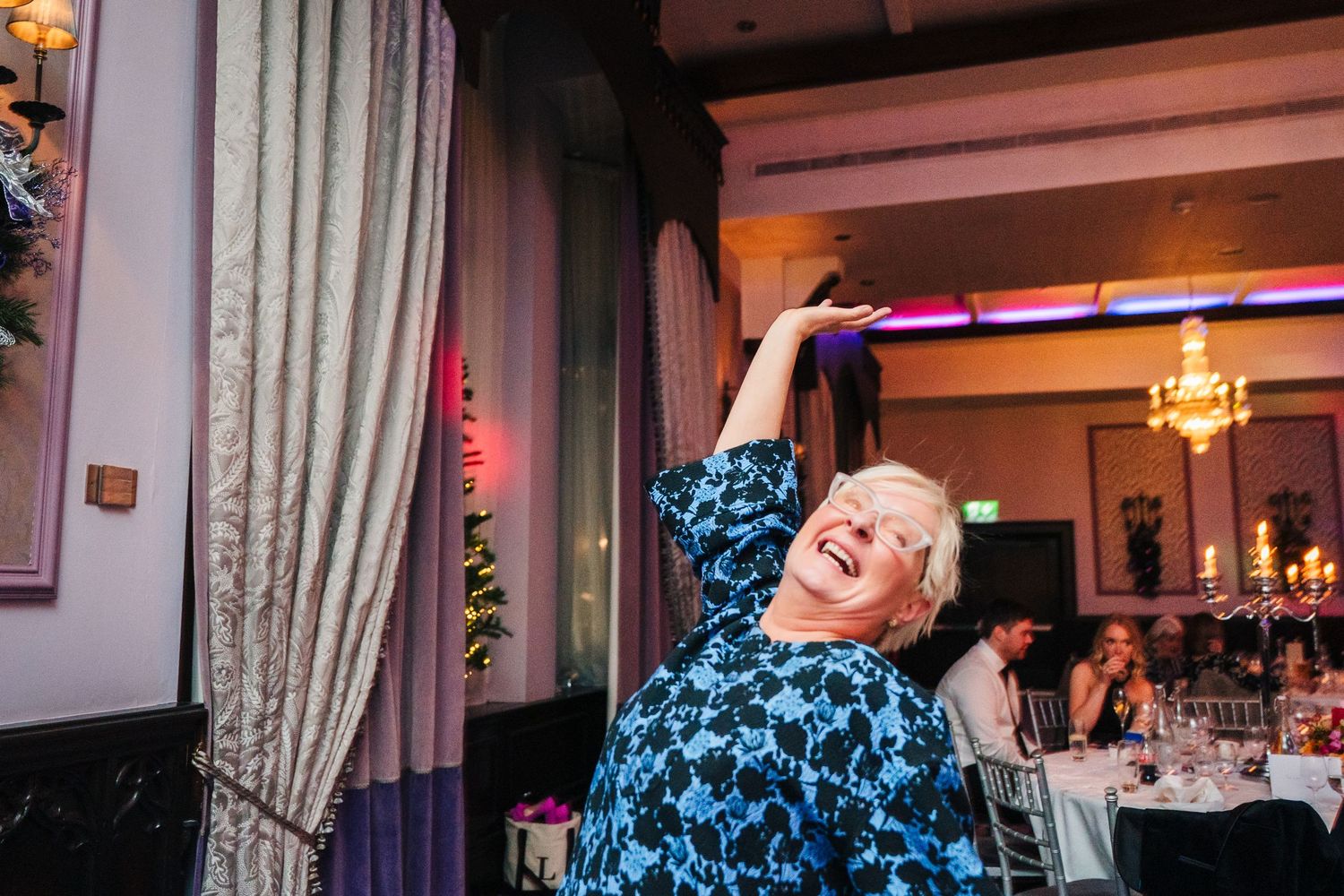 Wedding reception dance floor filled with joyful celebration and colorful lighting. Wedding photographer dublin