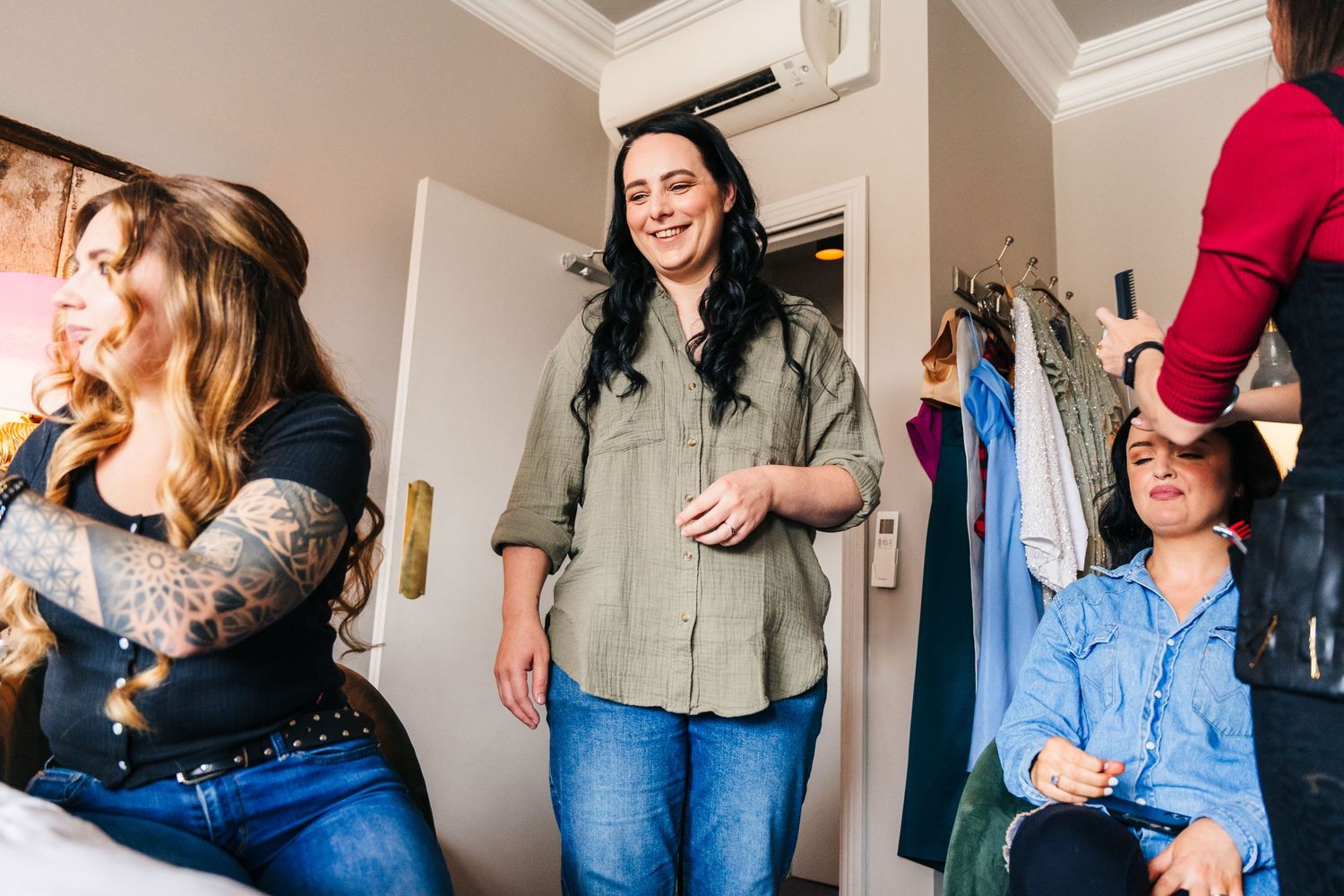 A group of people gathered indoors wearing casual attire in a candid social setting. House Dublin Wedding Photographer