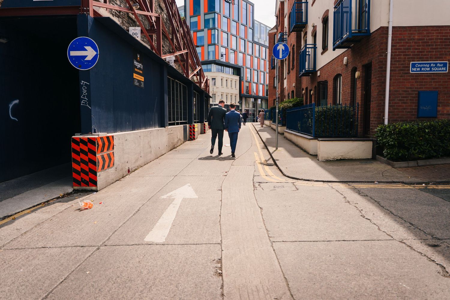 Empty urban street scene with brick buildings and directional signs. Same sex wedding PHOTOGRAPHER Dublin