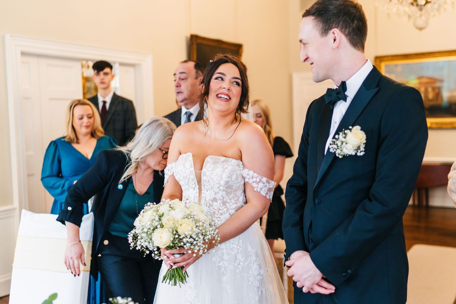 A joyous wedding ceremony moment showing emotional reactions in a beautiful indoor venue.  Wedding PHOTOGRAPHER Dublin