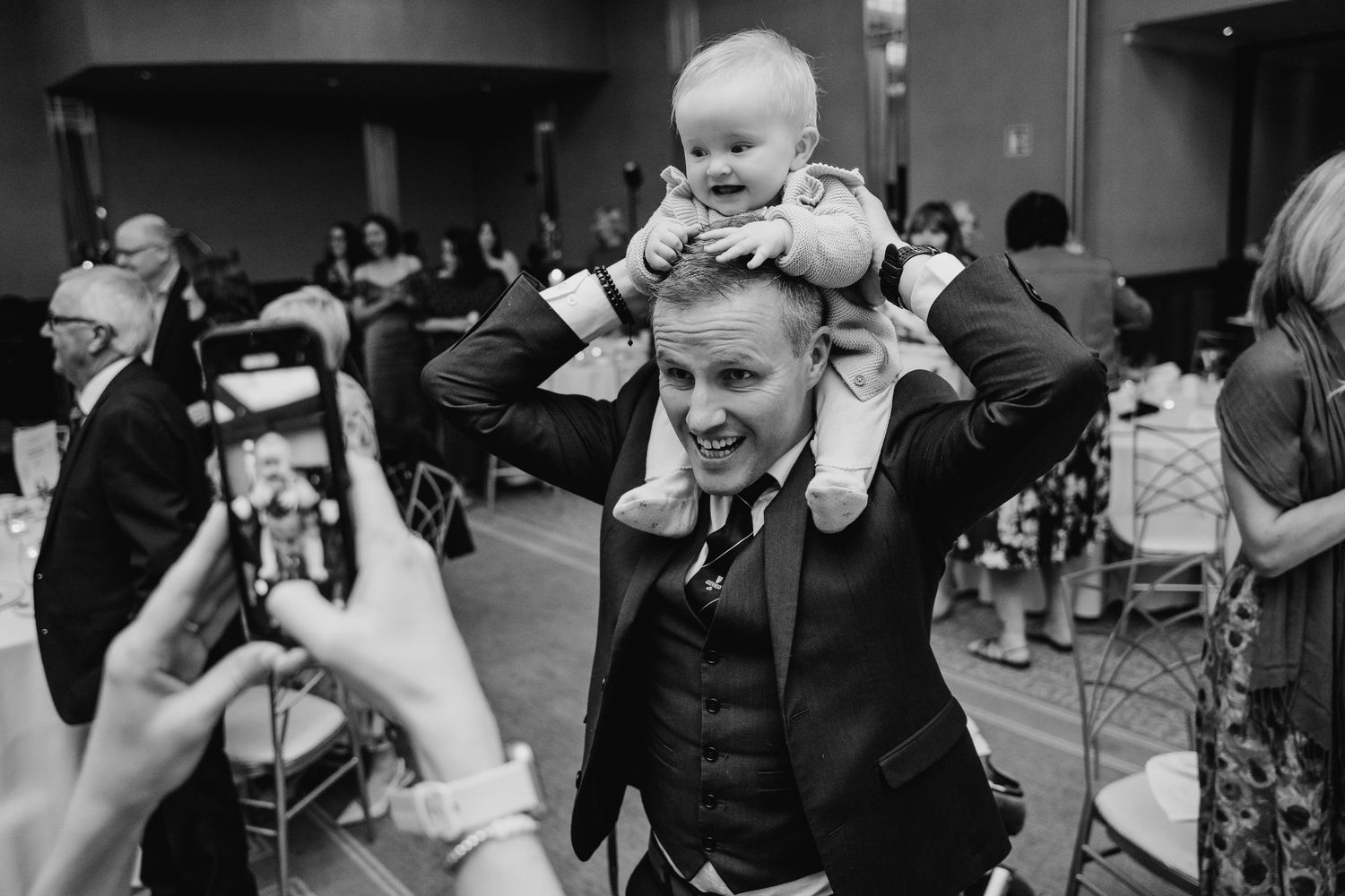 Candid black and white shots of wedding reception celebration with guests laughing.Wedding Photography Trim Castle Ireland