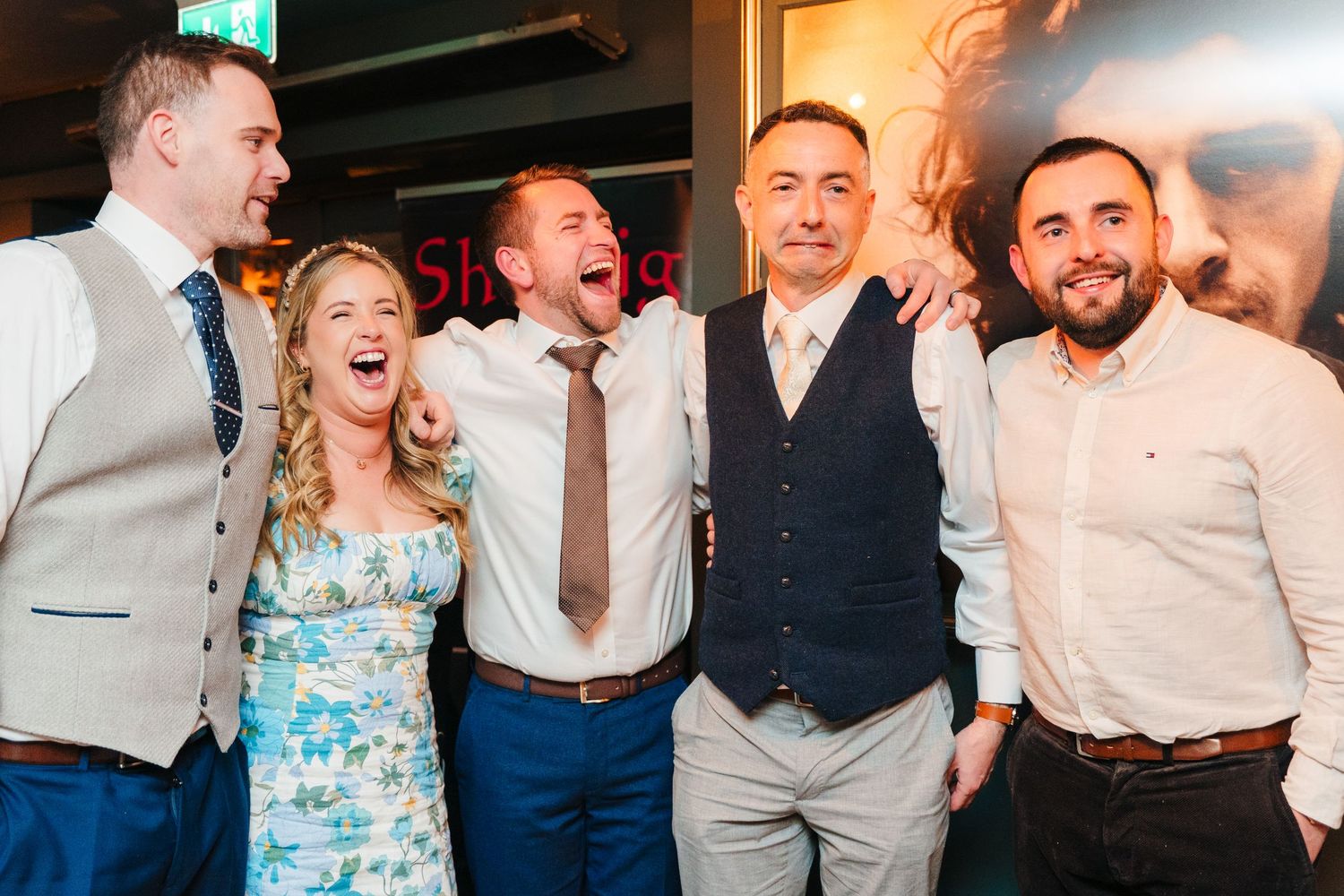 Wedding guests dancing and laughing together on a wooden dance floor at a reception celebration. Marco Pierre Dublin Wedding Photographer