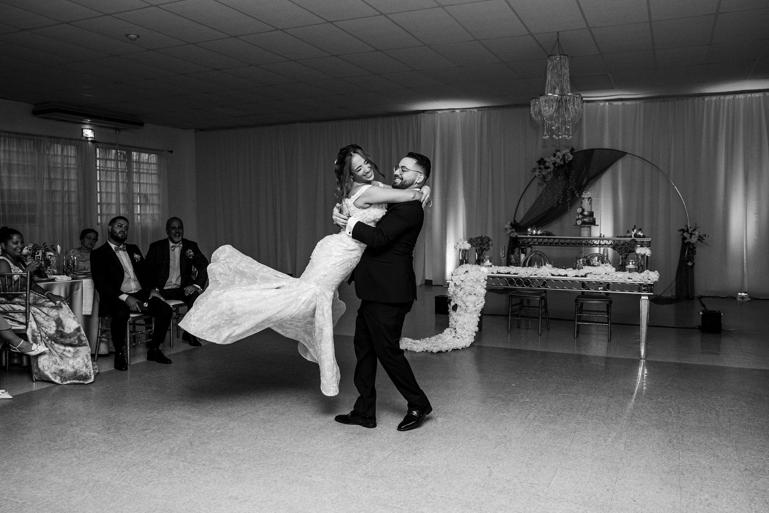 A black and white photo sequence shows a couple performing dramatic dance moves during a wedding reception.