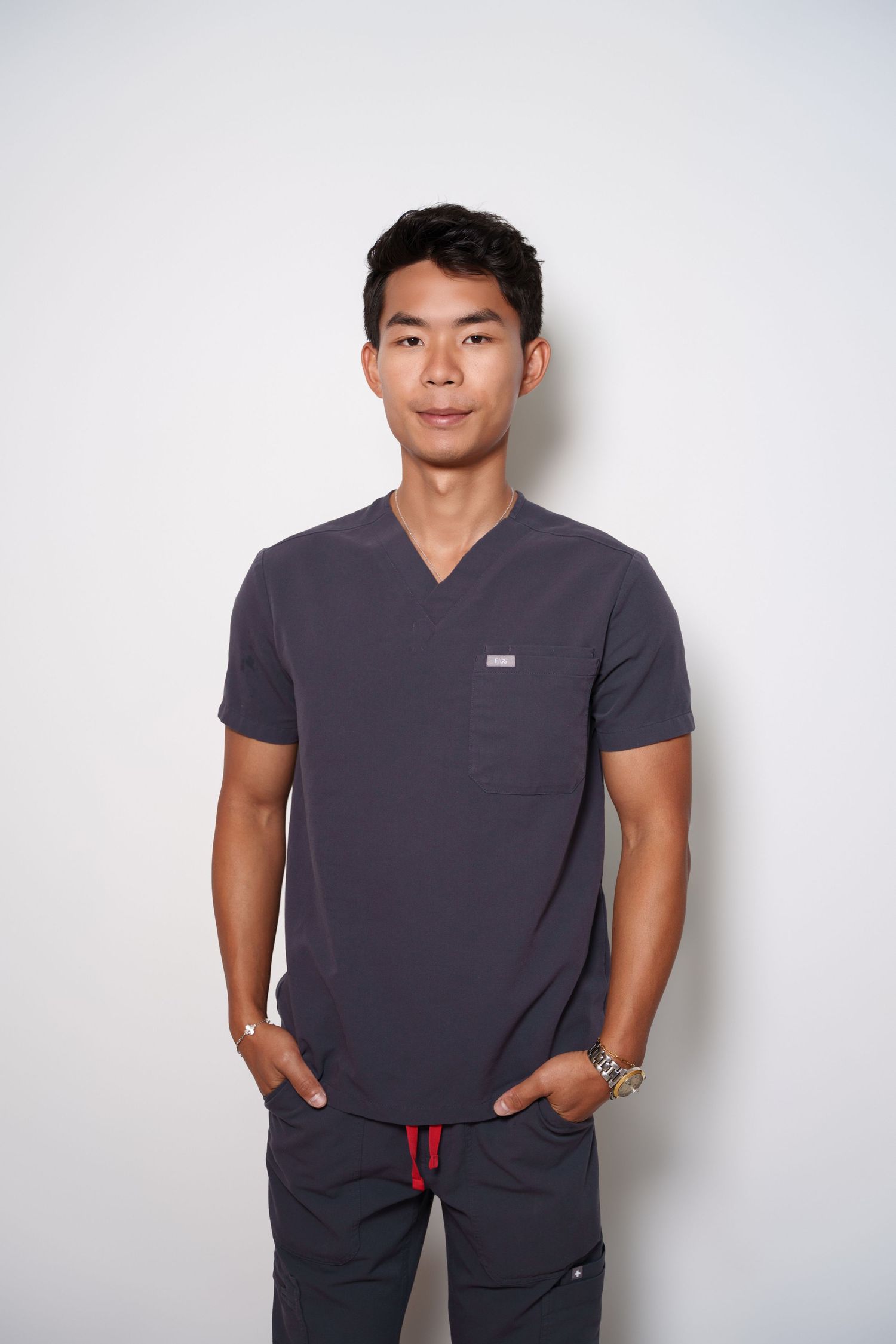 Person wearing a dark gray t-shirt poses against white background in three similar casual portraits. headshots new york professional headsho