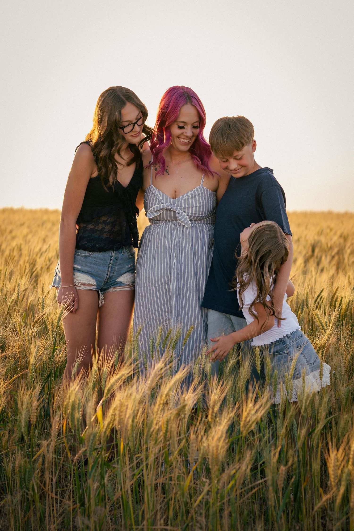 A family photo in the wheat fields of Kennewick, Washington. Photo taken by an affordable local photographer.