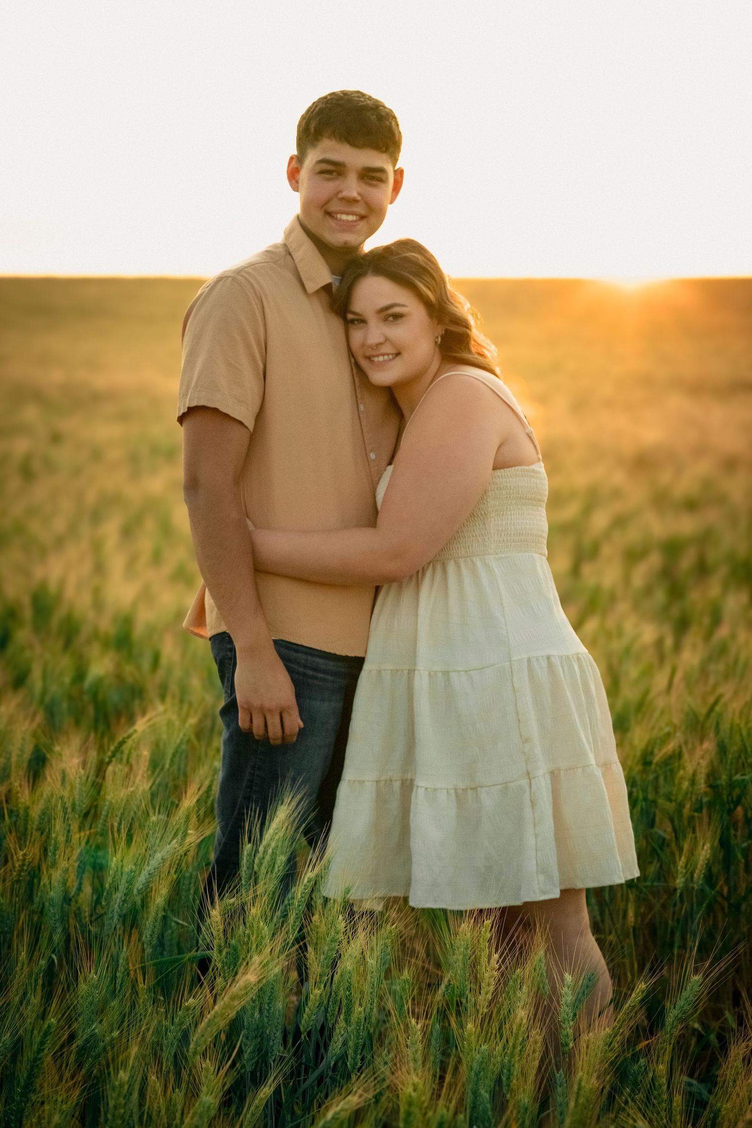 A couple photo session in the wheat fields of Kennewick, Washington. Photo taken by an affordable local photographer.