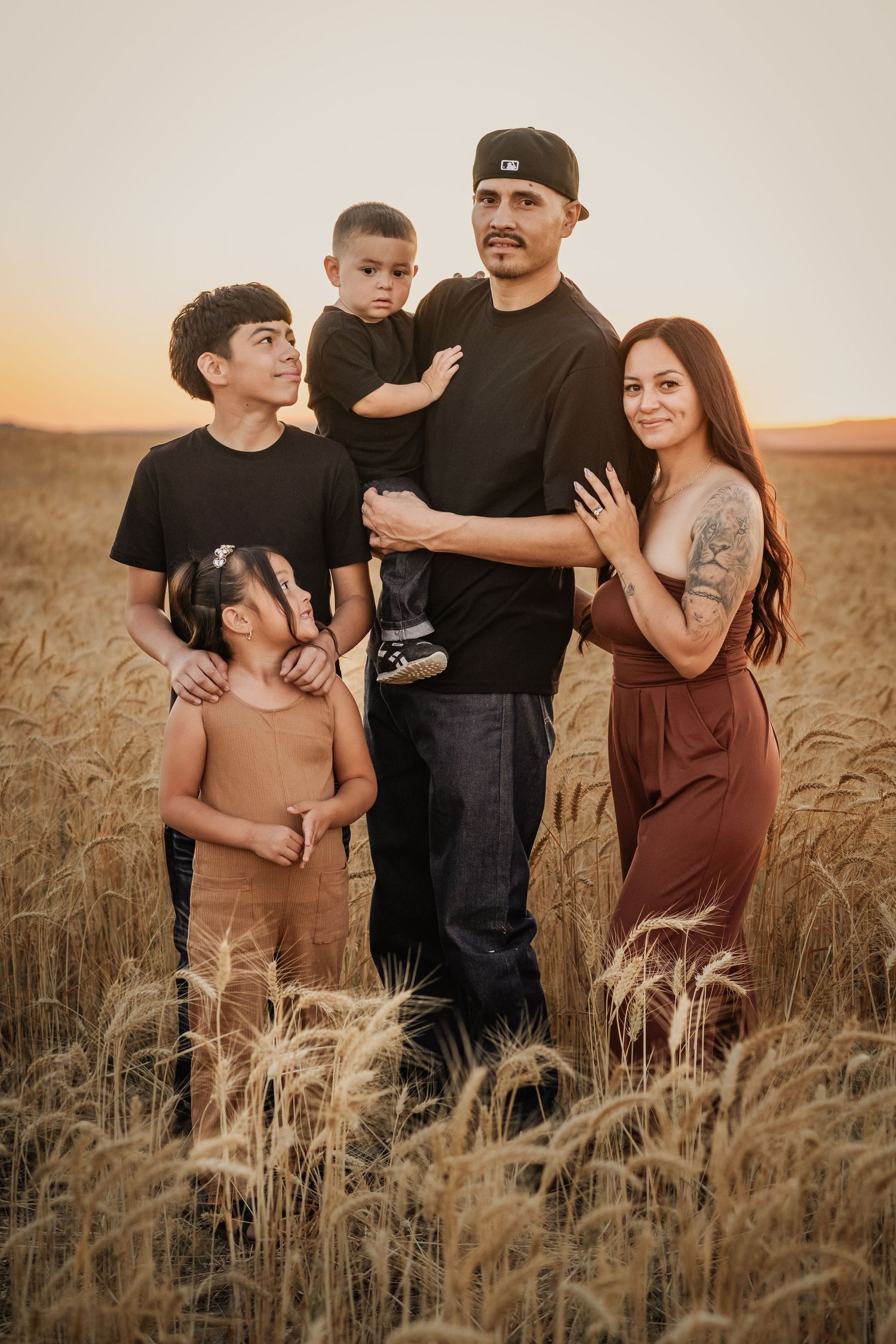 A family photo in the wheat fields of Kennewick, Washington. Photo taken by an affordable local photographer.