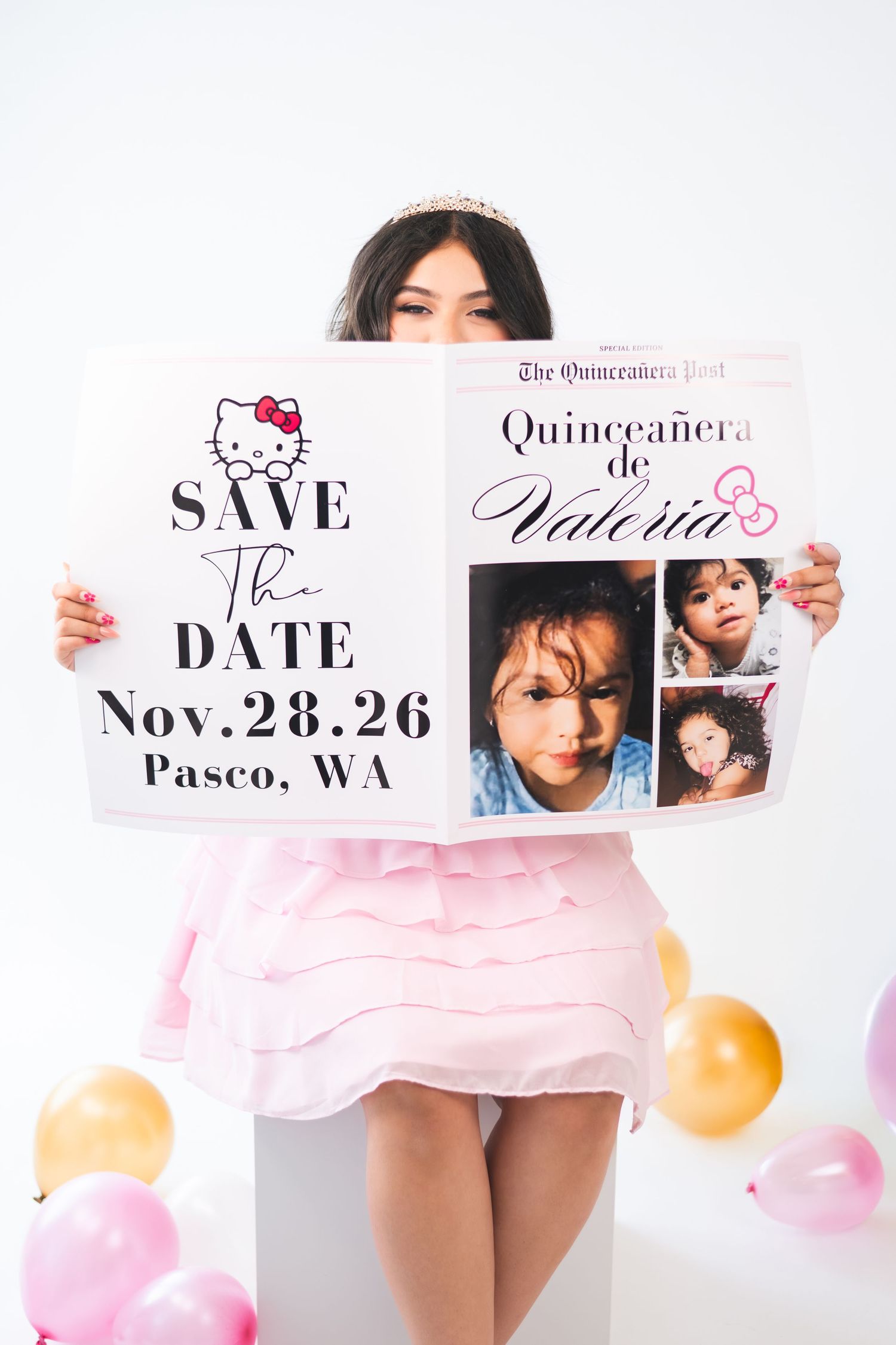 Young girl in pink dress holds a Hello Kitty Quinceañera save the date sign for Valeria, Nov 28 26, Pasco WA.