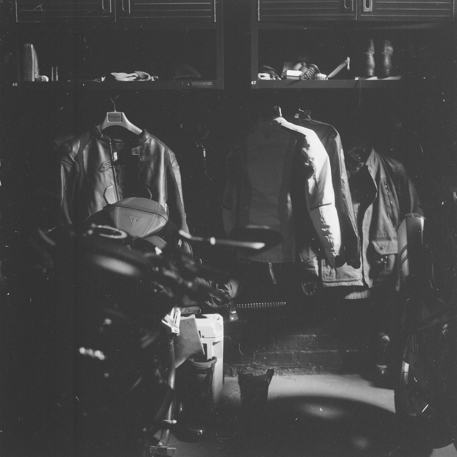 motorcycle and helmet, triumph scrambler 1200, black and white film photography