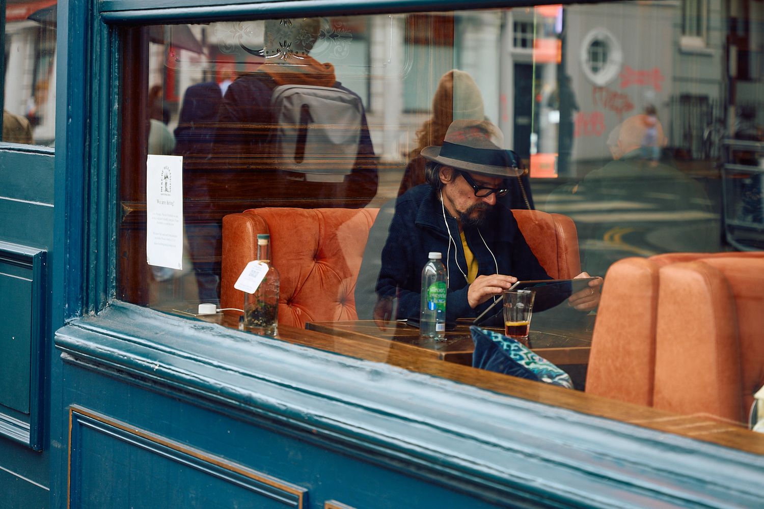 travel and editorial photography, men sitting in a restaurant by the window in London