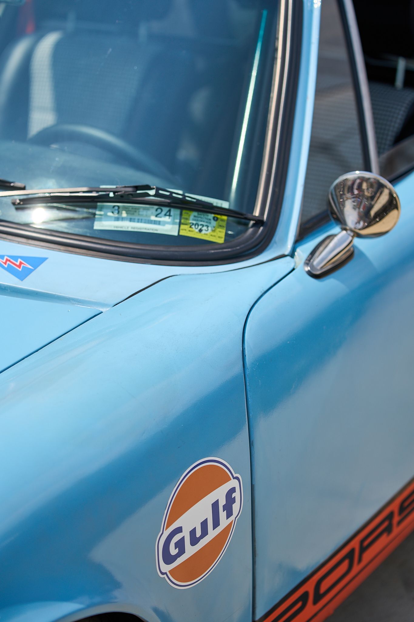 car photography, detail of a vintage Porsche with Gulf livery