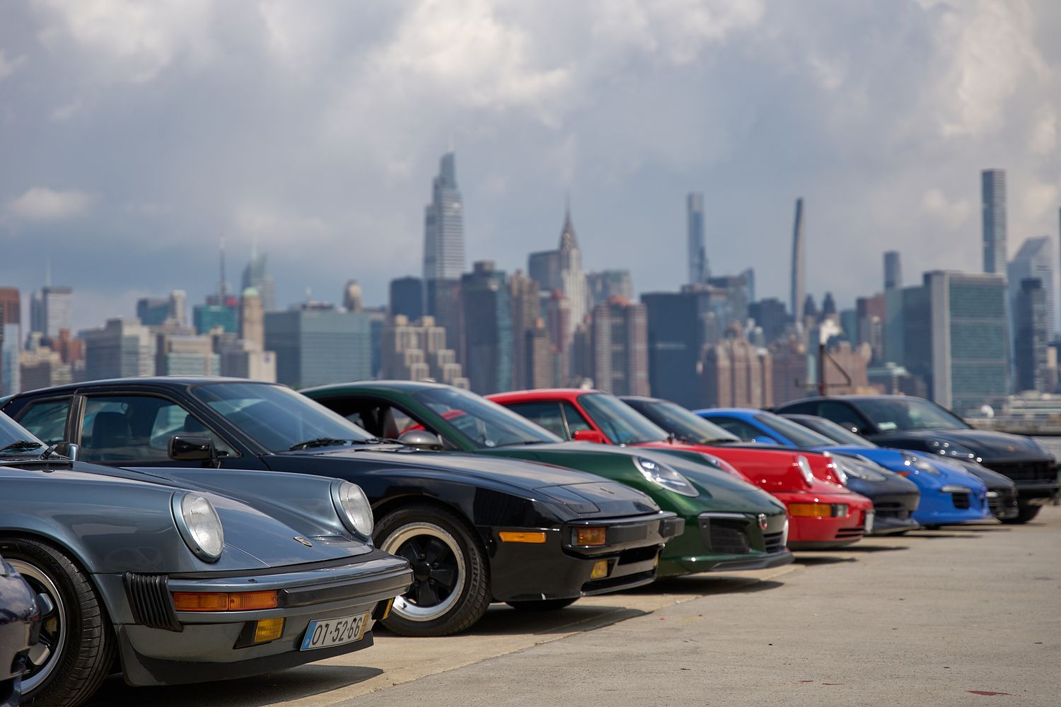 car photography, Gathering of Cars and Porsches with the NYC Skyline in the background