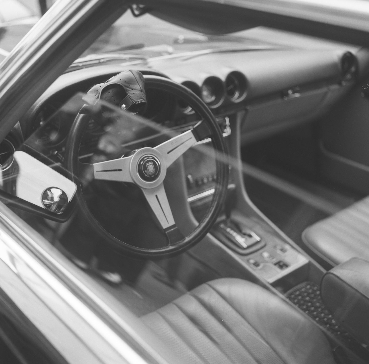 black and white photo of a vintage car at a wheels of NYC event at the Rythm zero coffee shop in Greenpoint Brooklyn, NY