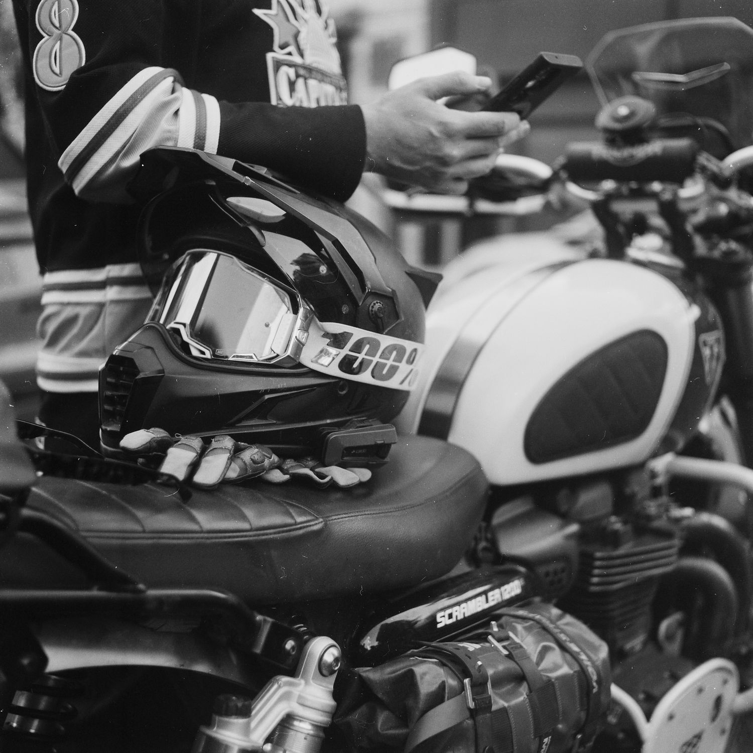 motorcycle and helmet, triumph scrambler 1200, black and white film photography