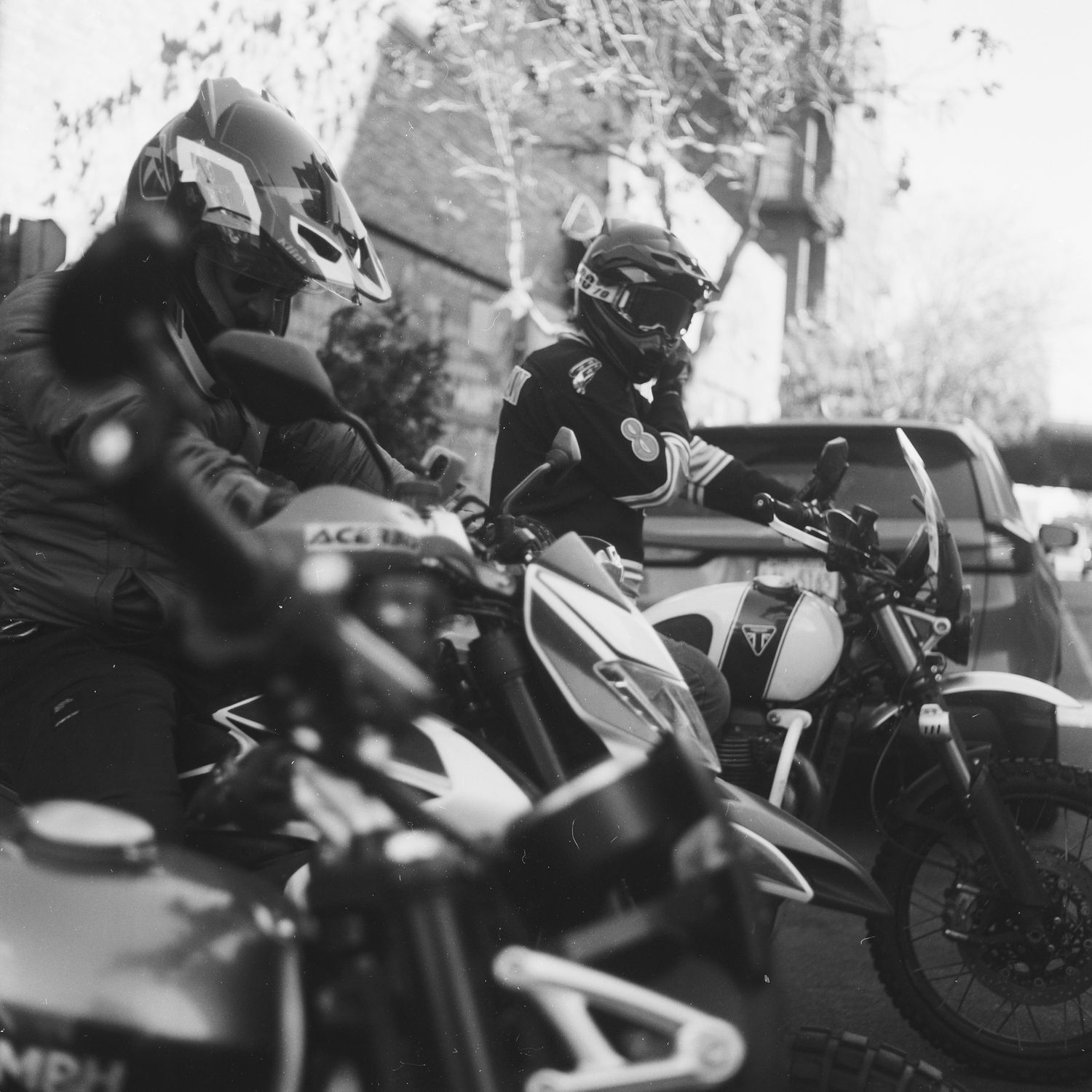 motorcycle and helmet, triumph scrambler 1200, black and white film photography