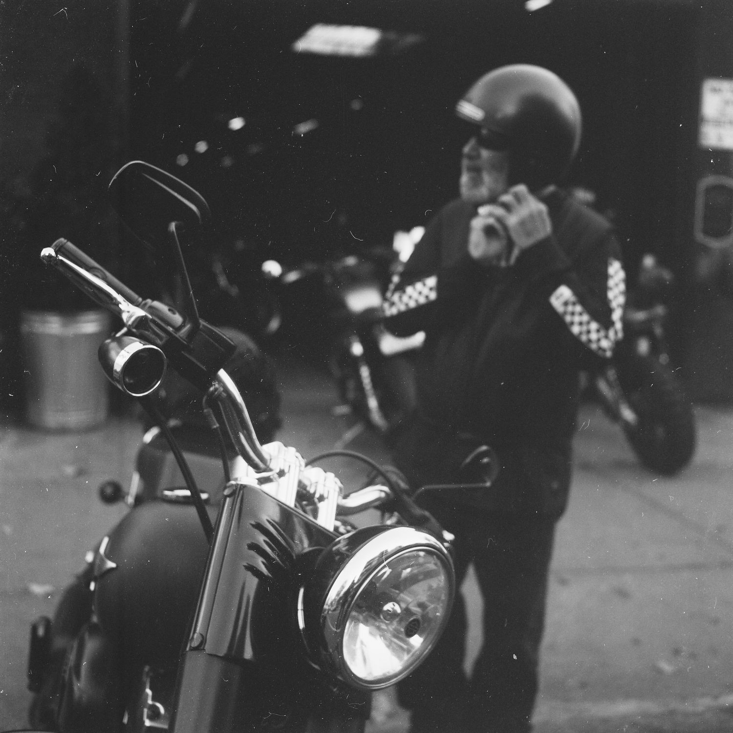 motorcycle and helmet, triumph scrambler 1200, black and white film photography