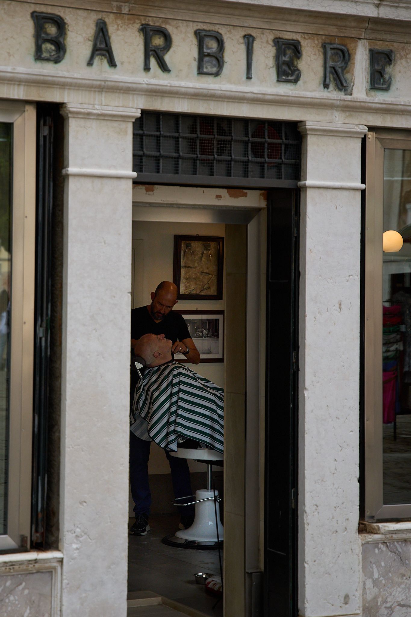 Venice and Burano travel photography, men barber working in his shop
