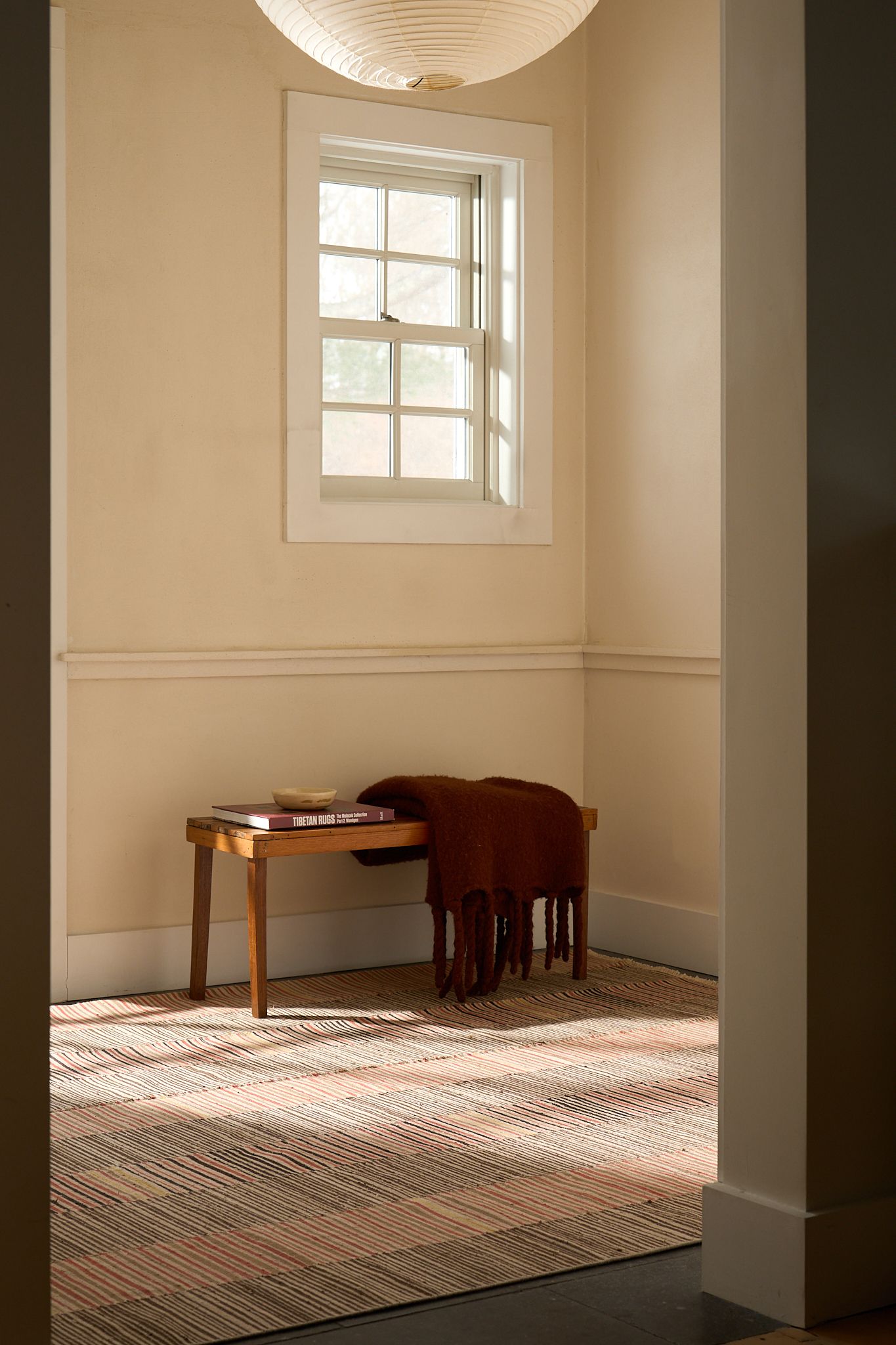Product and lifestyle photograph of a rug designed and made by Postcard company, photographed upstate NY