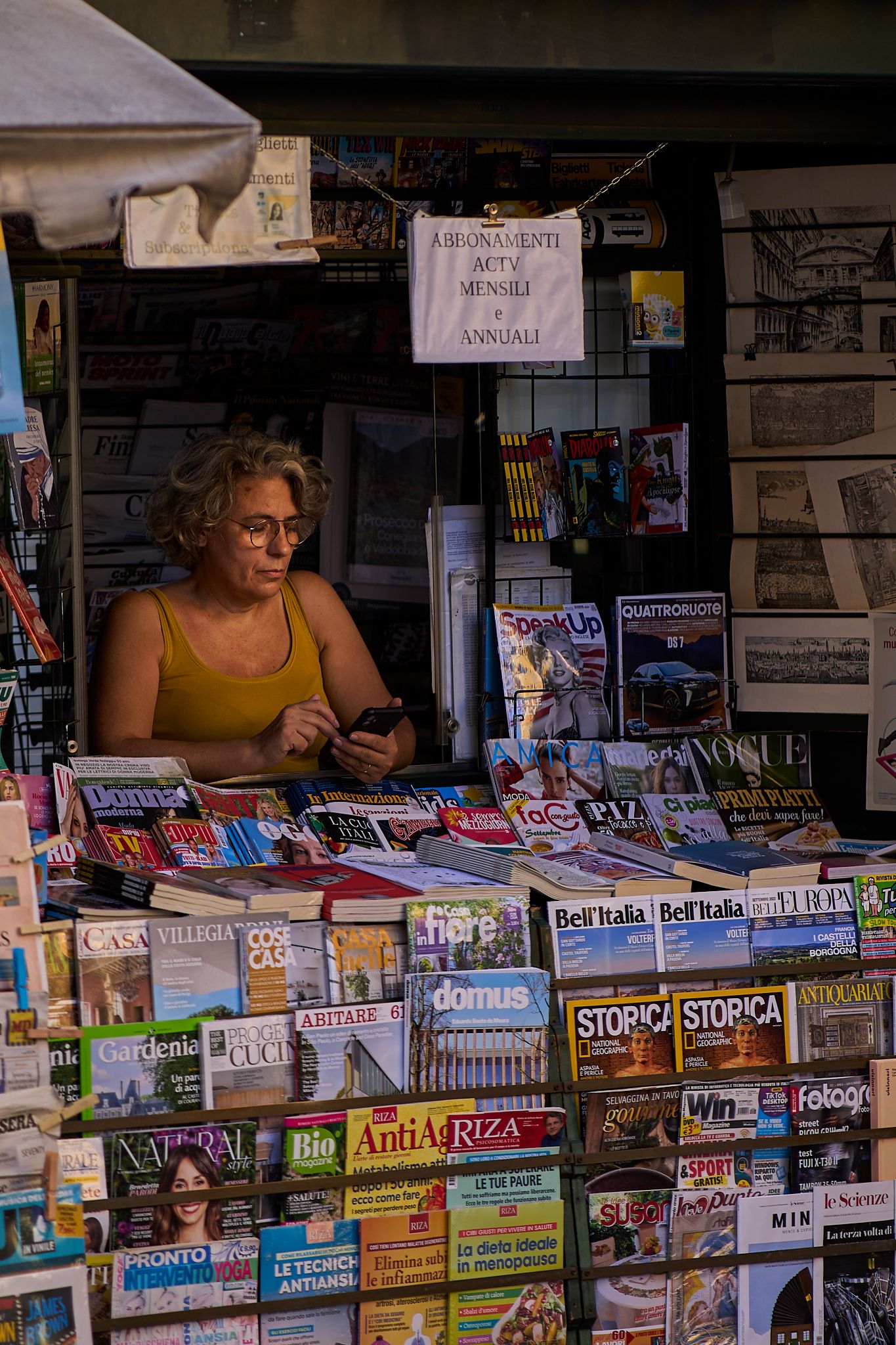 Venice travel photography, portrait of a lady selling magazines