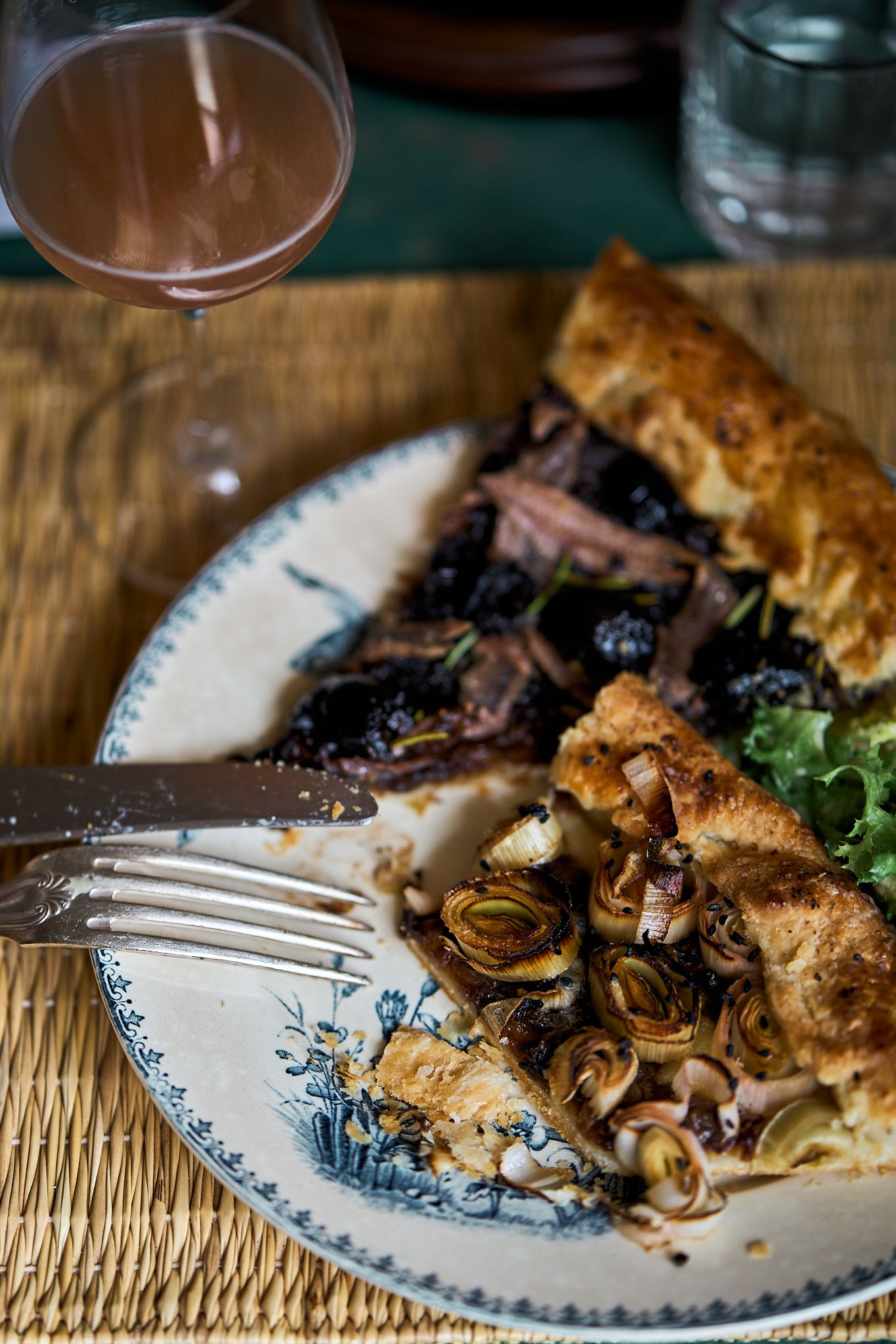 Travel and editorial photography, Provence, France, plate of homecooked pie dish with a glass of rose wine