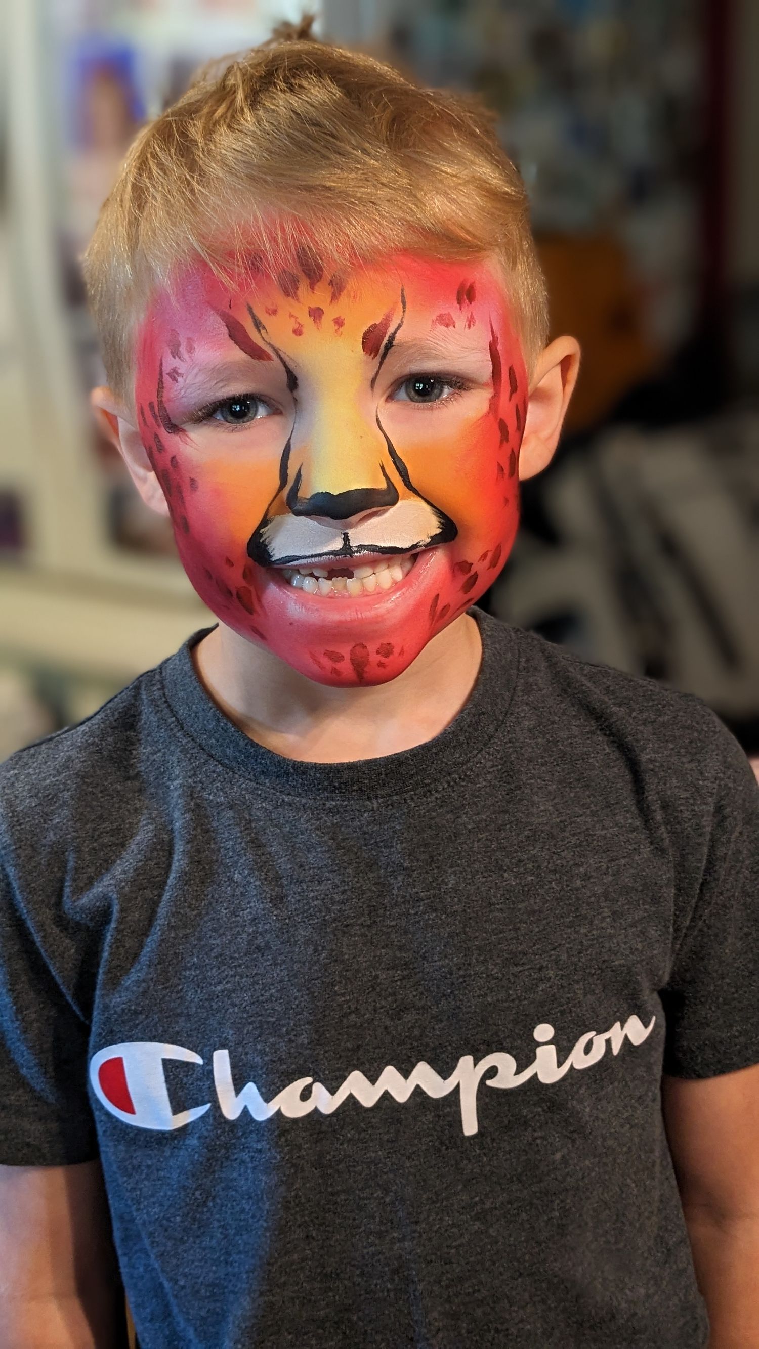 Child, unique and creative, cheetah face paint for zoo day in Columbus, Ohio at the Columbus Zoo