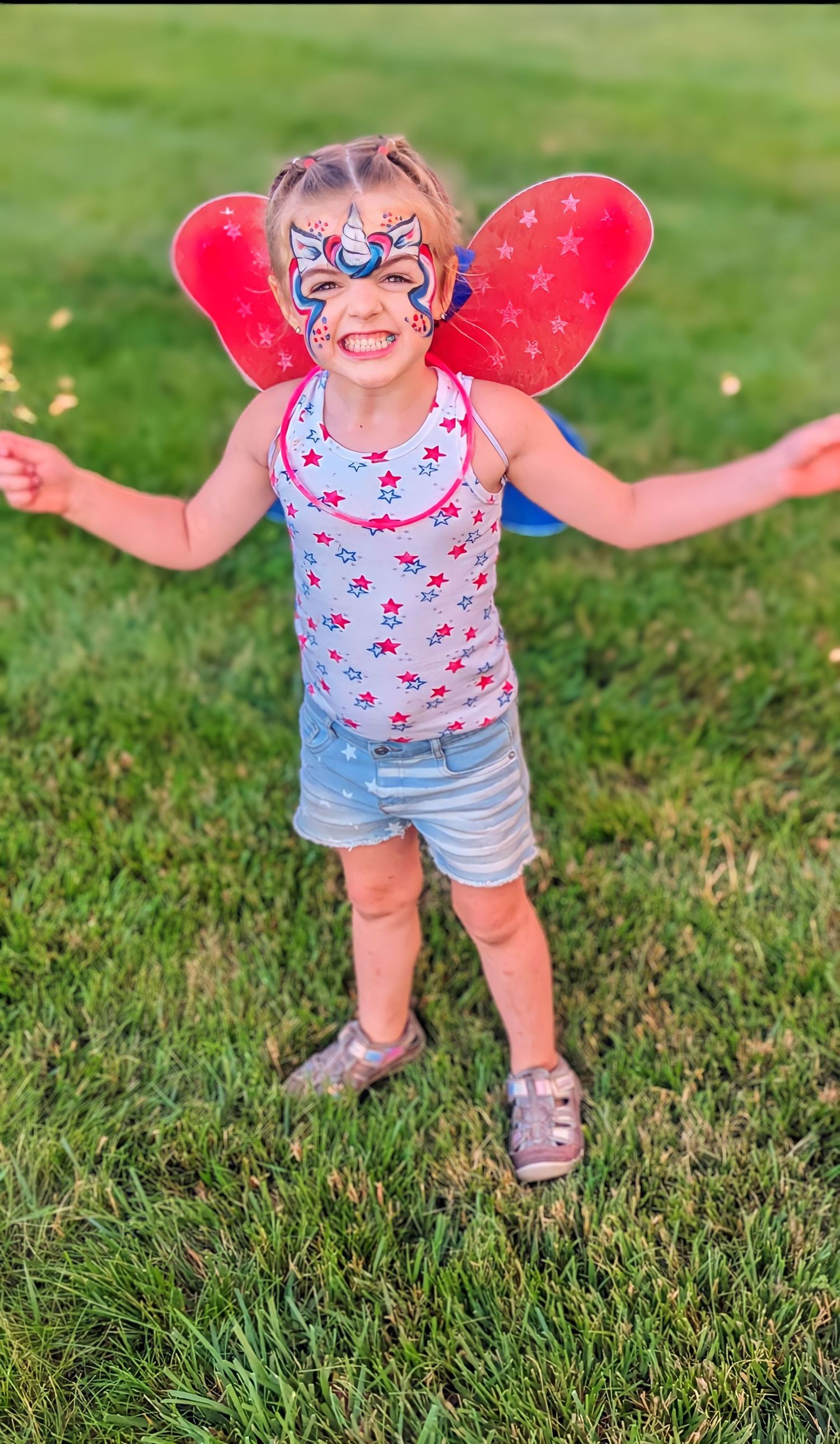 Child, patriotic face paint at 4th of July event in London, Ohio. America!