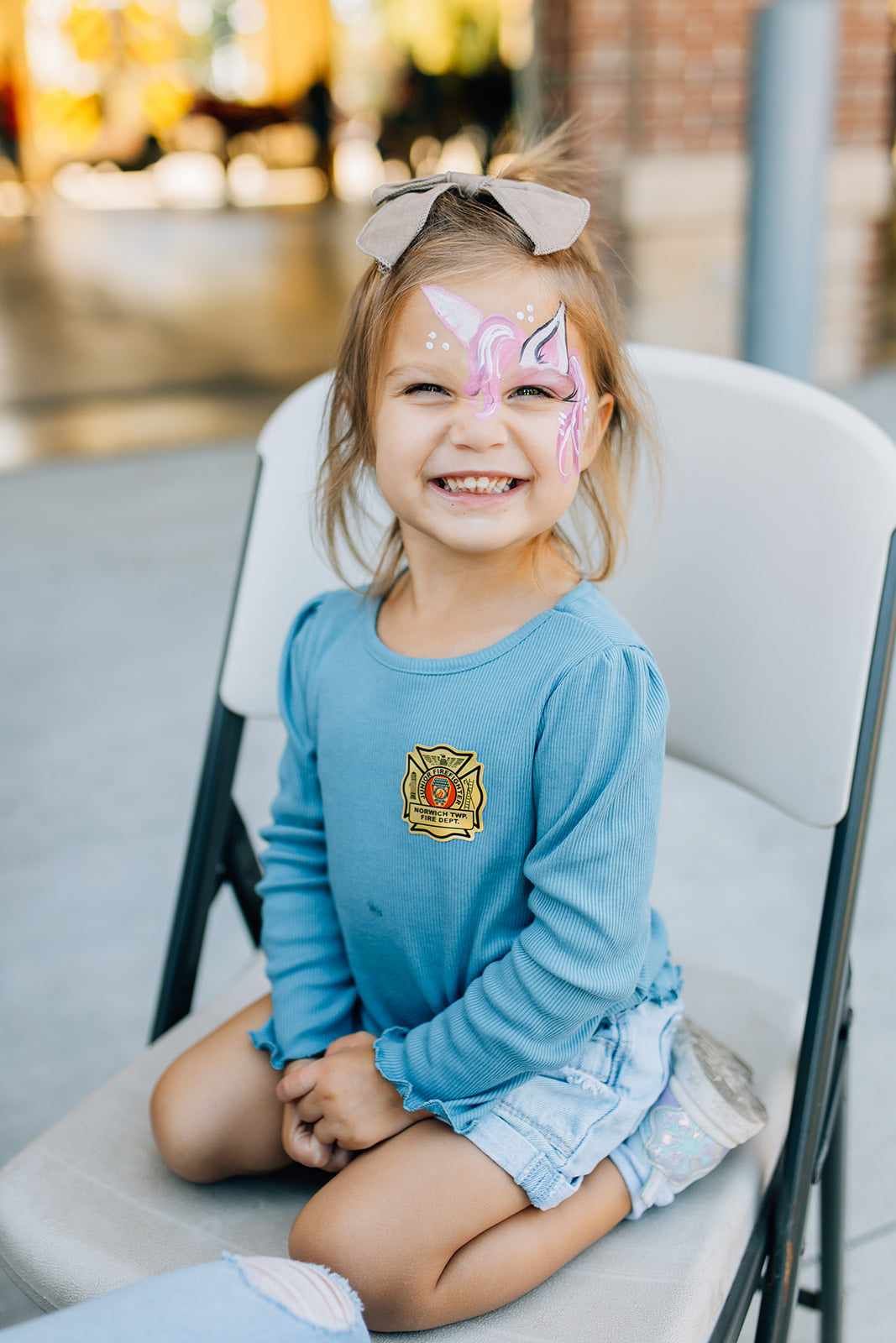 Child, unicorn face paint at firehouse community family event in Hilliard, Ohio.