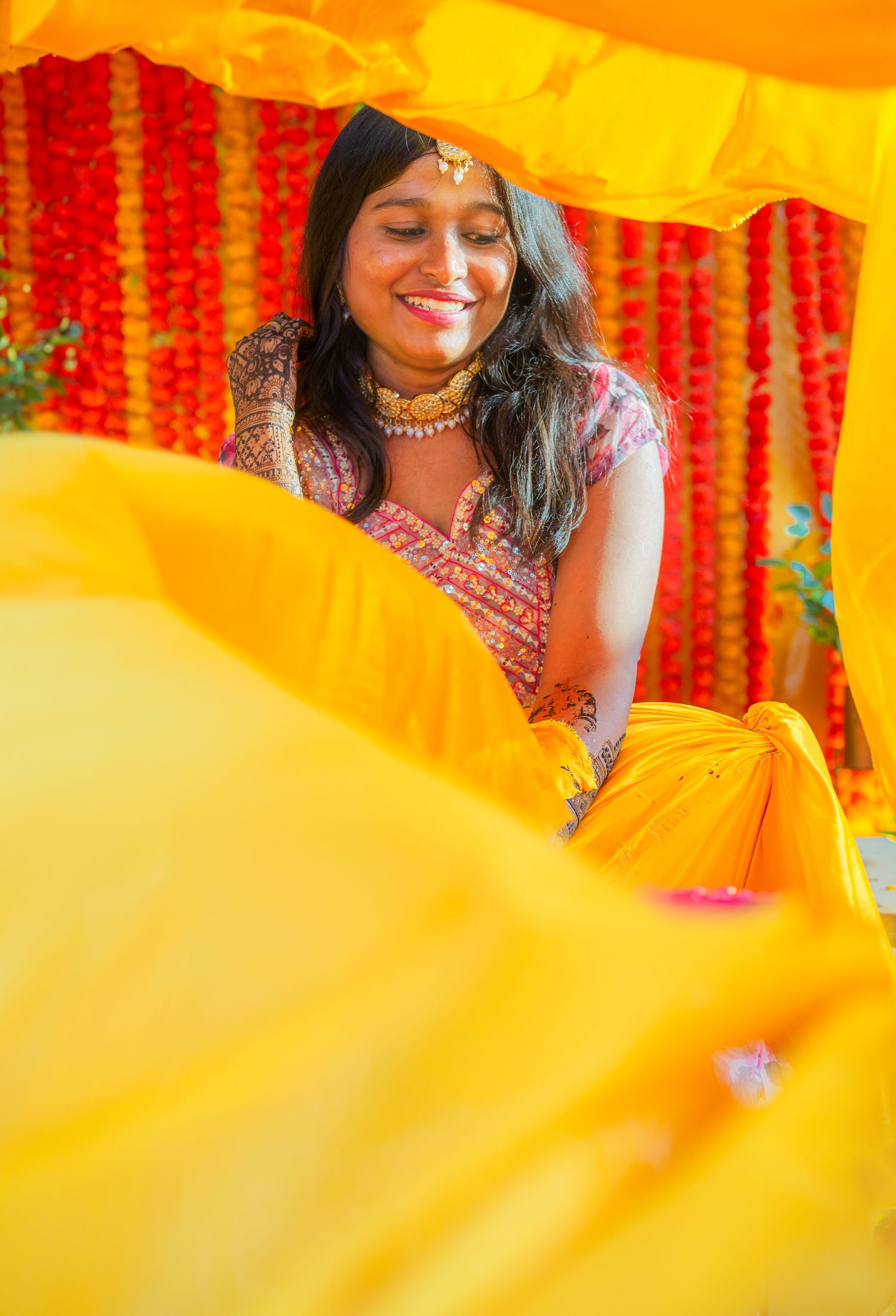 Festive scene with yellow and red decorations during an Indian cultural celebration.