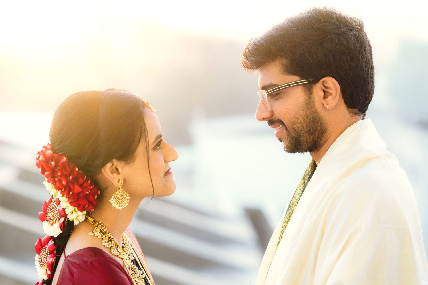 A couple shares romantic moments in traditional Indian attire during their wedding celebration.